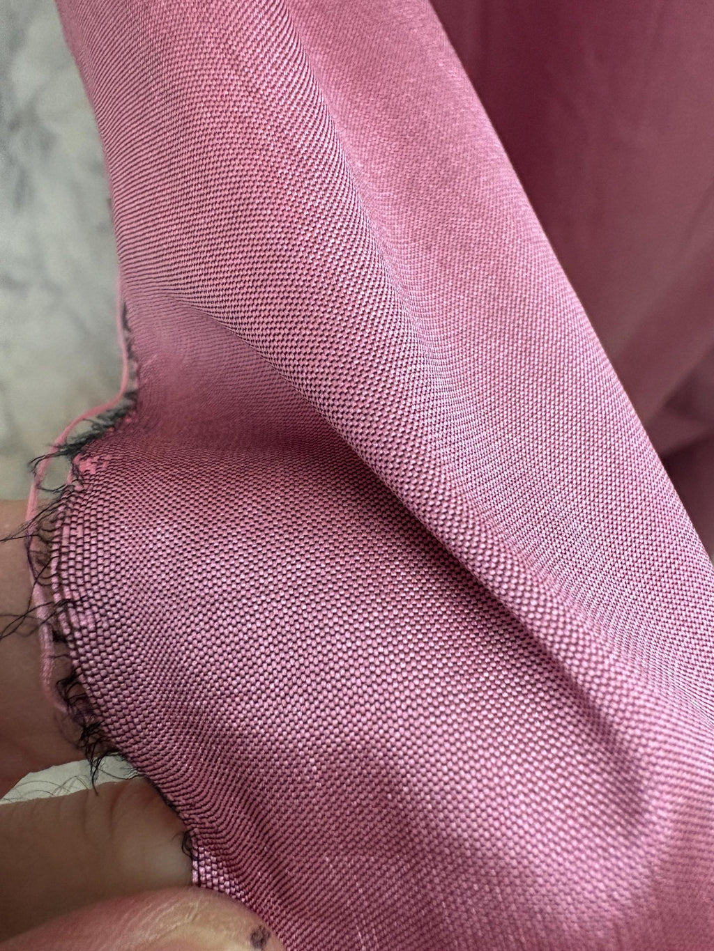 2-yard cut of rust taffeta fabric, 58" wide, polyester. Features a black undertone, perfect for party dresses and formal wear.