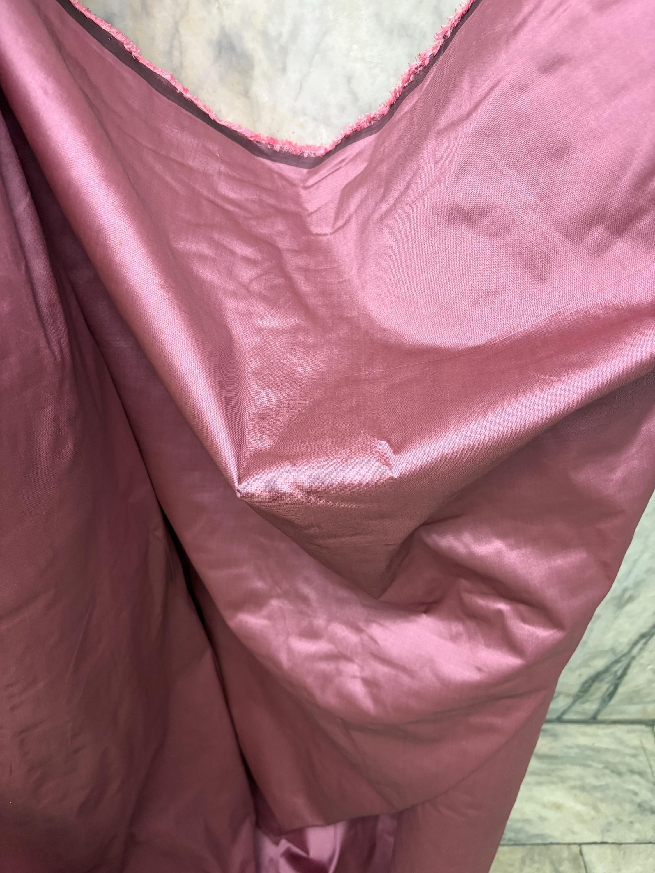 2-yard cut of rust taffeta fabric, 58" wide, polyester. Features a black undertone, perfect for party dresses and formal wear.