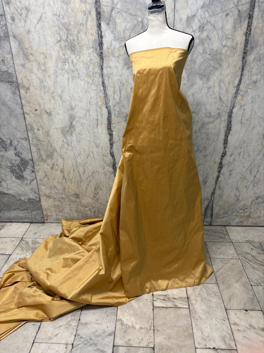 100% silk Taffeta fabric width 54" color is gold. Machine made, fabric has slubs. Free sample. Nas2217 A