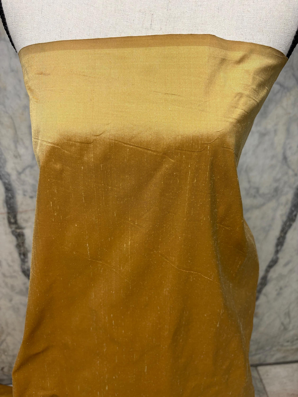 100% silk Taffeta fabric width 54" color is gold. Machine made, fabric has slubs. Free sample. Nas2217 A