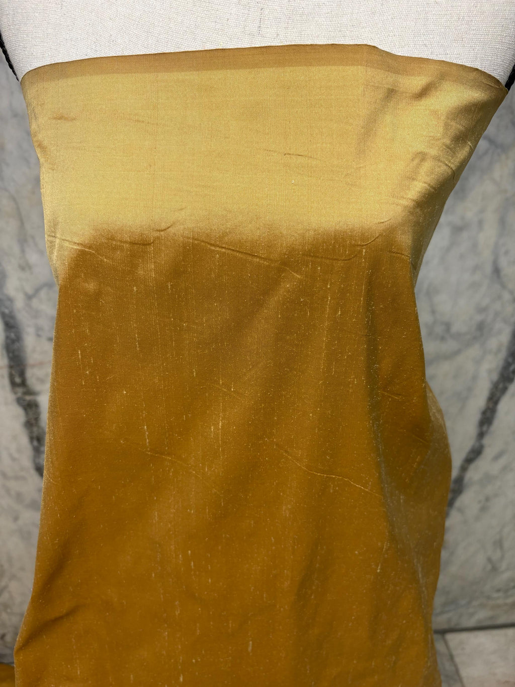 100% silk Taffeta fabric width 54" color is gold. Machine made, fabric has slubs. Free sample. Nas2217 A