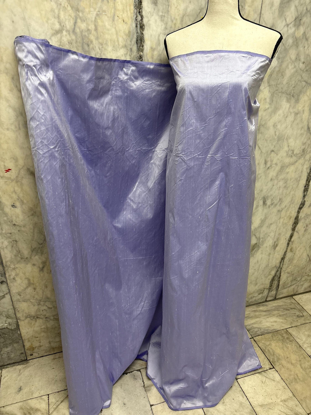 Lilac silk Taffeta width 54" color is Lilac with white warp. Machine made, fabric has thin slubs. Item NAS 2286