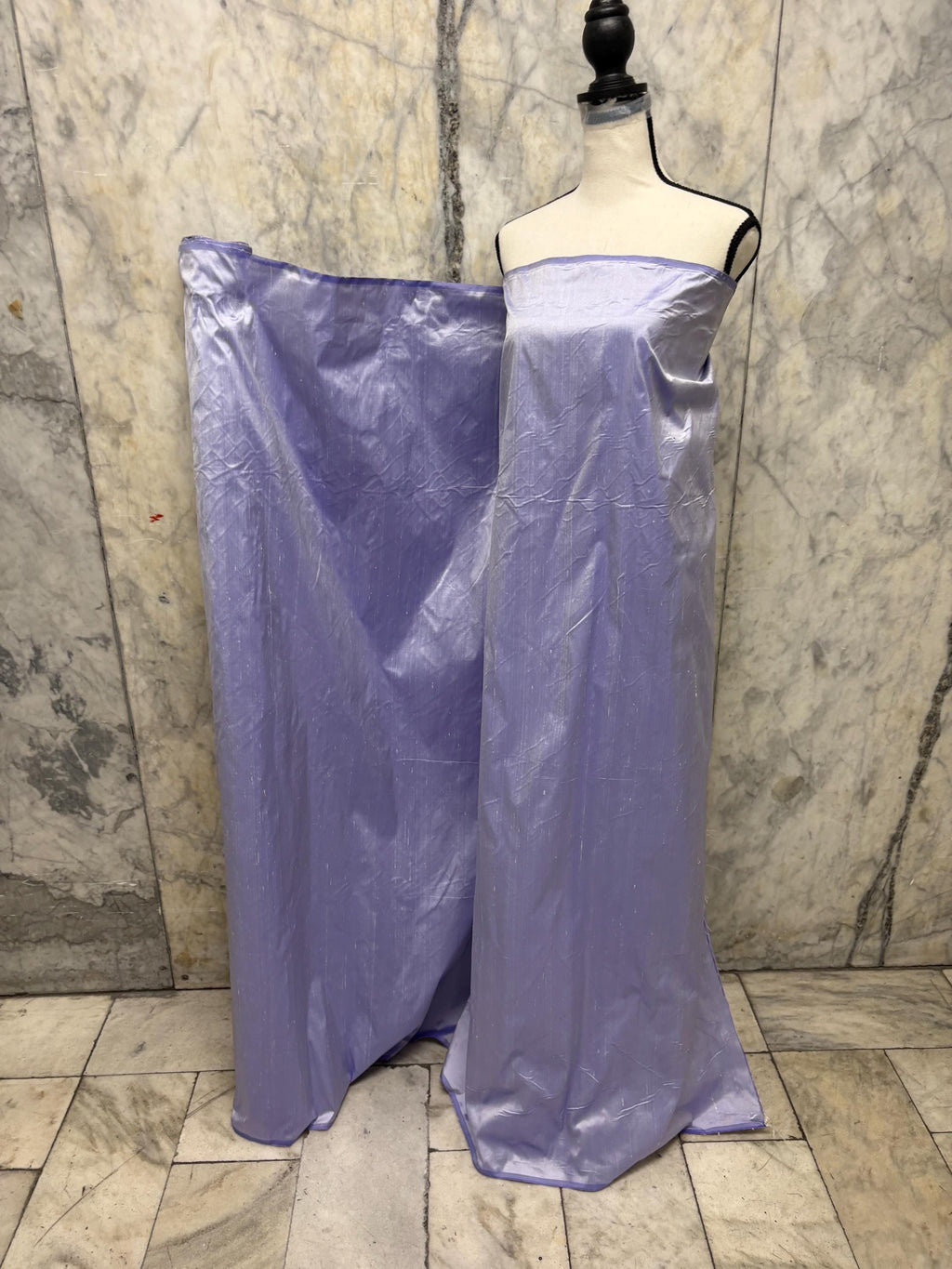 Lilac silk Taffeta width 54" color is Lilac with white warp. Machine made, fabric has thin slubs. Item NAS 2286