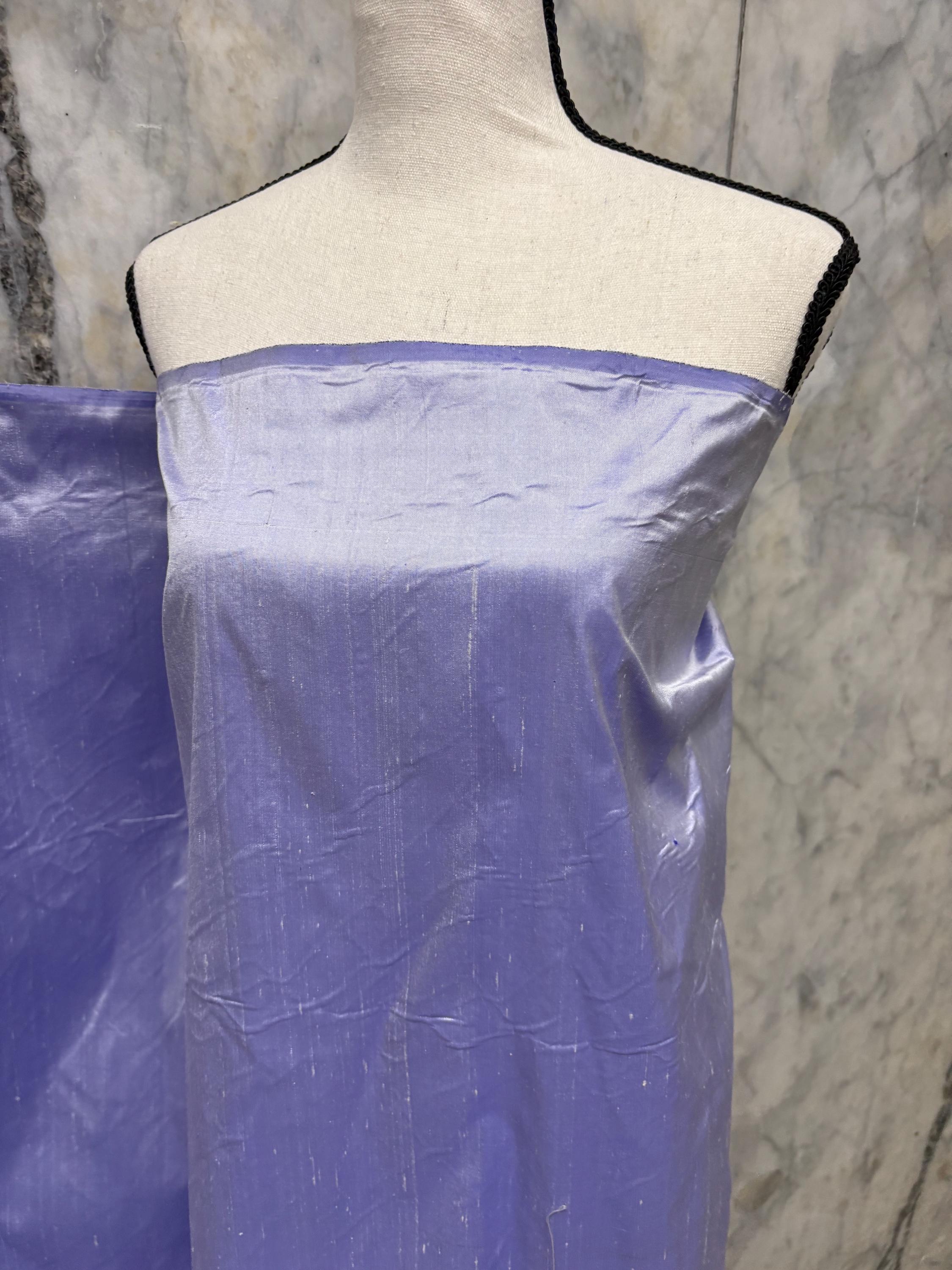 Lilac silk Taffeta width 54" color is Lilac with white warp. Machine made, fabric has thin slubs. Item NAS 2286