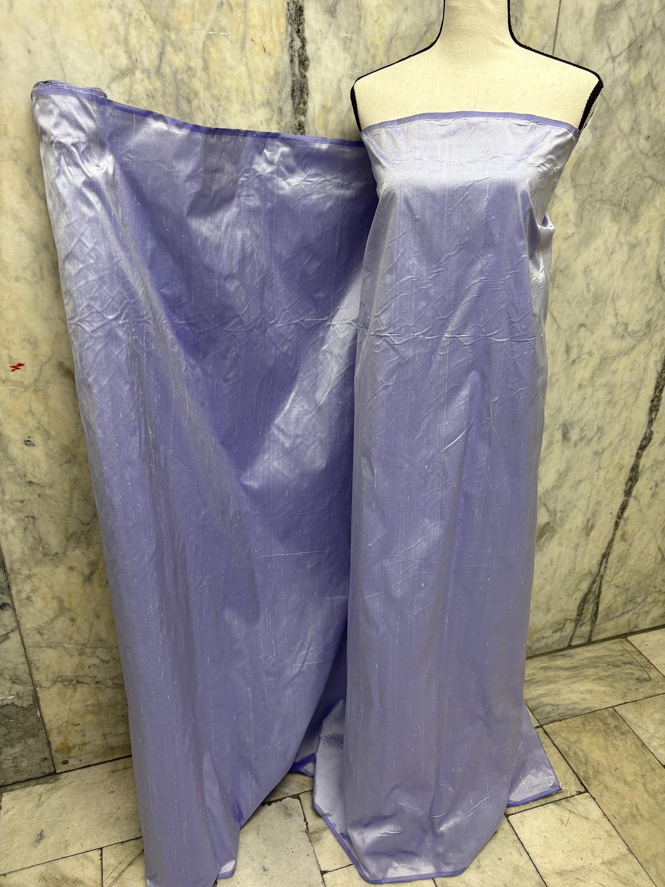Lilac silk Taffeta width 54" color is Lilac with white warp. Machine made, fabric has thin slubs. Item NAS 2286