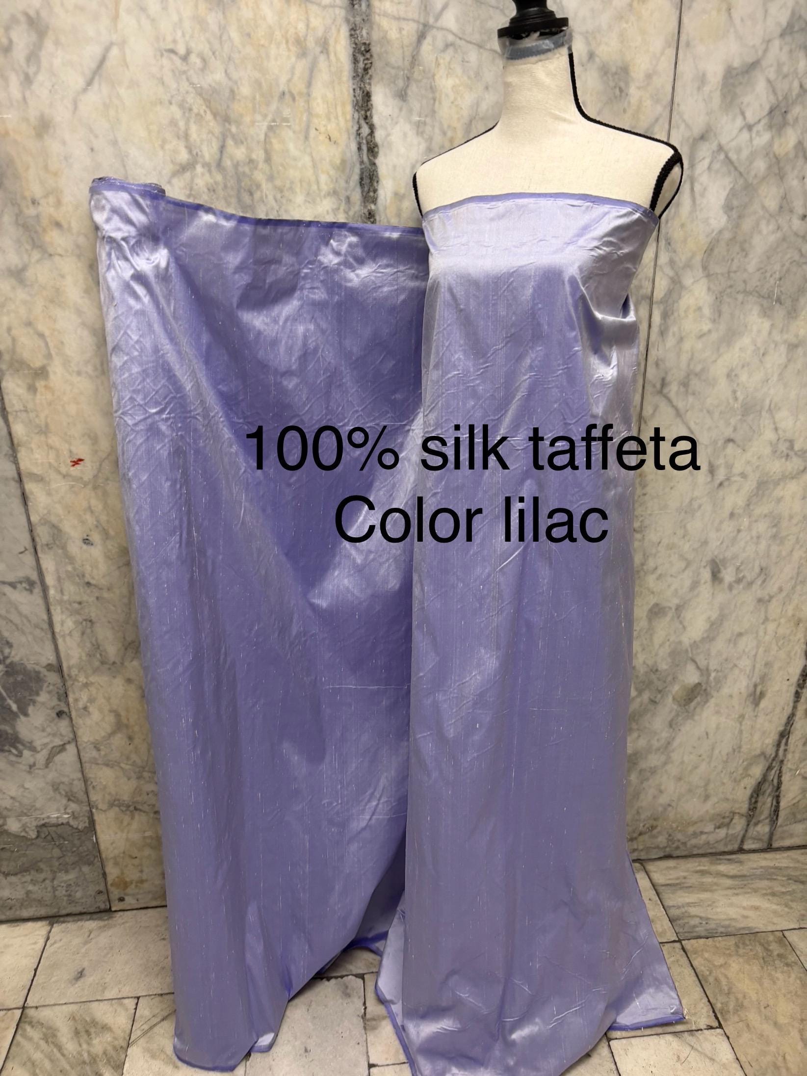 Lilac silk Taffeta width 54" color is Lilac with white warp. Machine made, fabric has thin slubs. Item NAS 2286