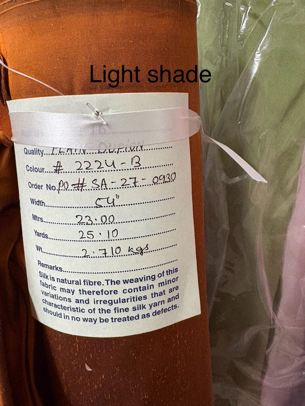 100% silk Dupioni Taffeta width 54" color is Rust with black warp. Machine made, fabric has slubs. Item # 8. free sample. Nas2224-B