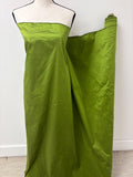 100% silk Dupioni Taffeta width 54" color is Lime with black warp. Machine made, fabric has slubs. free sample. Nas2244