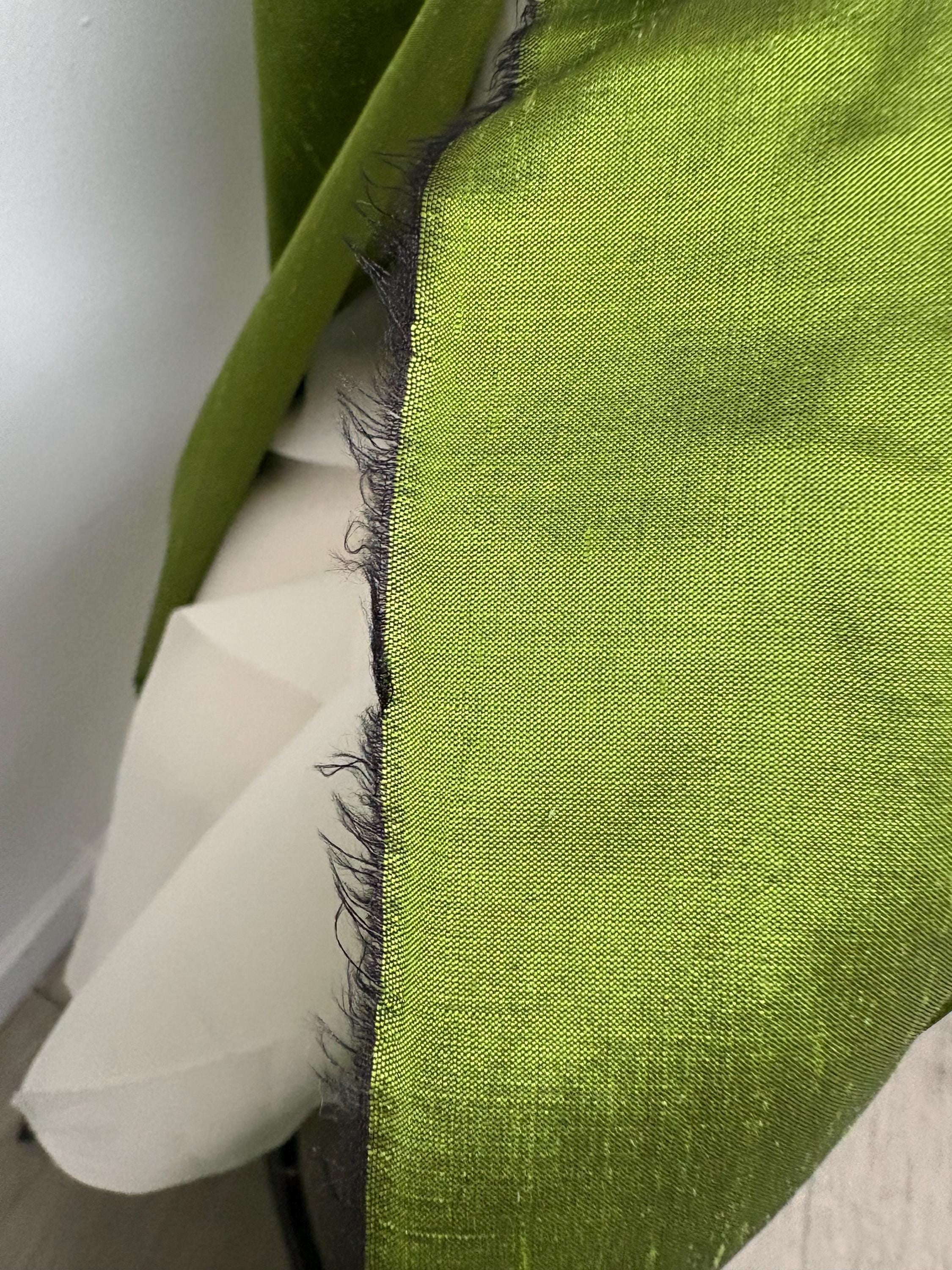 100% silk Dupioni Taffeta width 54" color is Lime with black warp. Machine made, fabric has slubs. free sample. Nas2244
