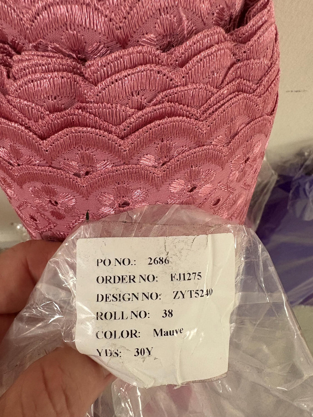 Eyelet fabric made of poly-cotton with all-over embroidery and double scalloped edges for a delicate finish. color Mauve design # 2