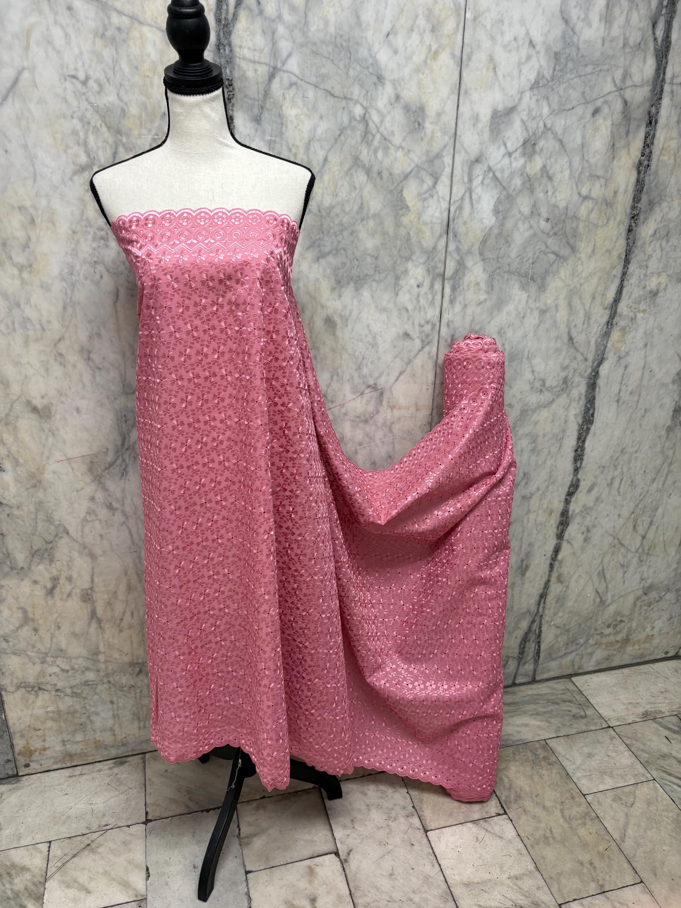 Eyelet fabric made of poly-cotton with all-over embroidery and double scalloped edges for a delicate finish. color Mauve design # 2