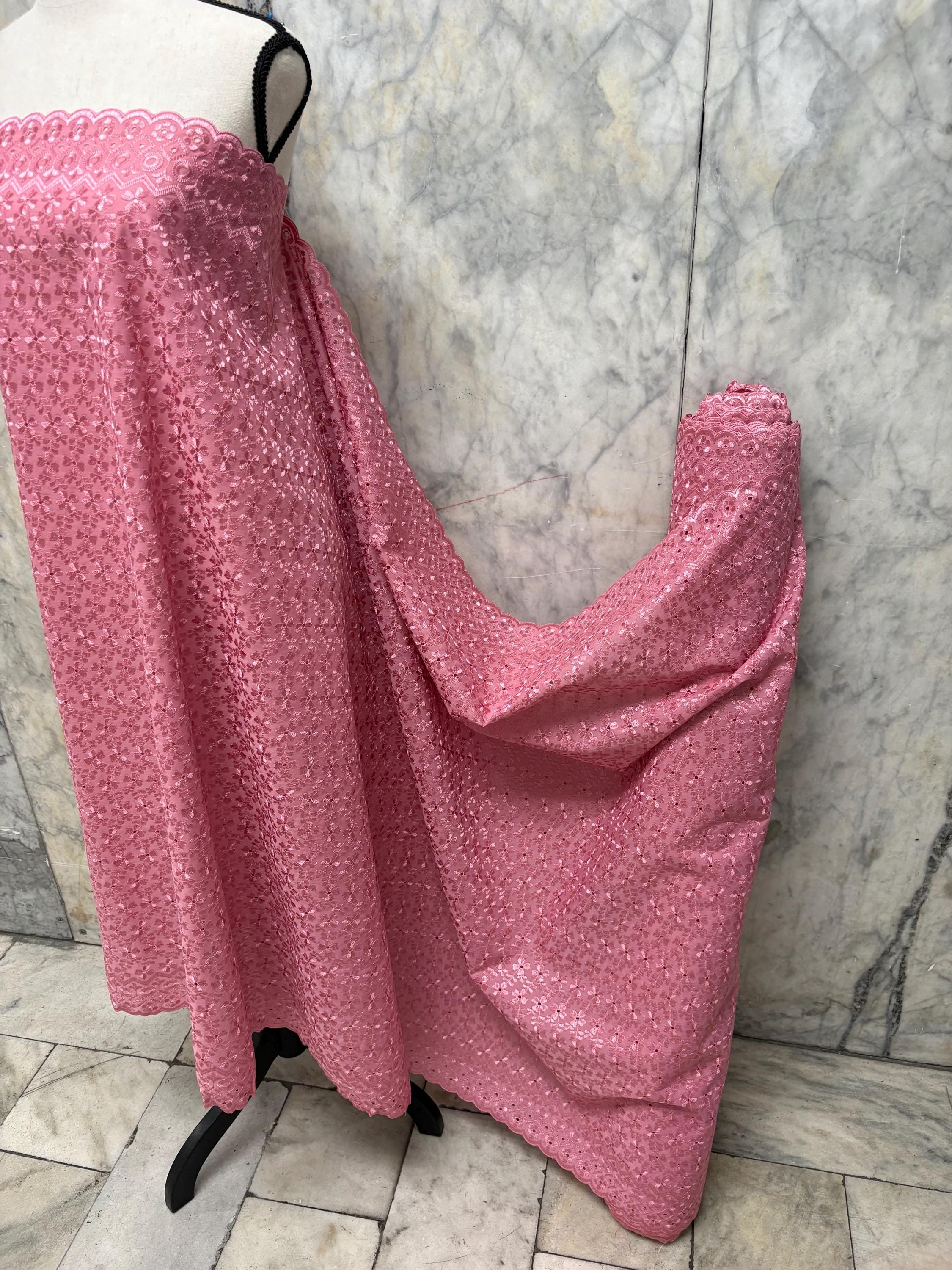 Eyelet fabric made of poly-cotton with all-over embroidery and double scalloped edges for a delicate finish. color Mauve design # 2