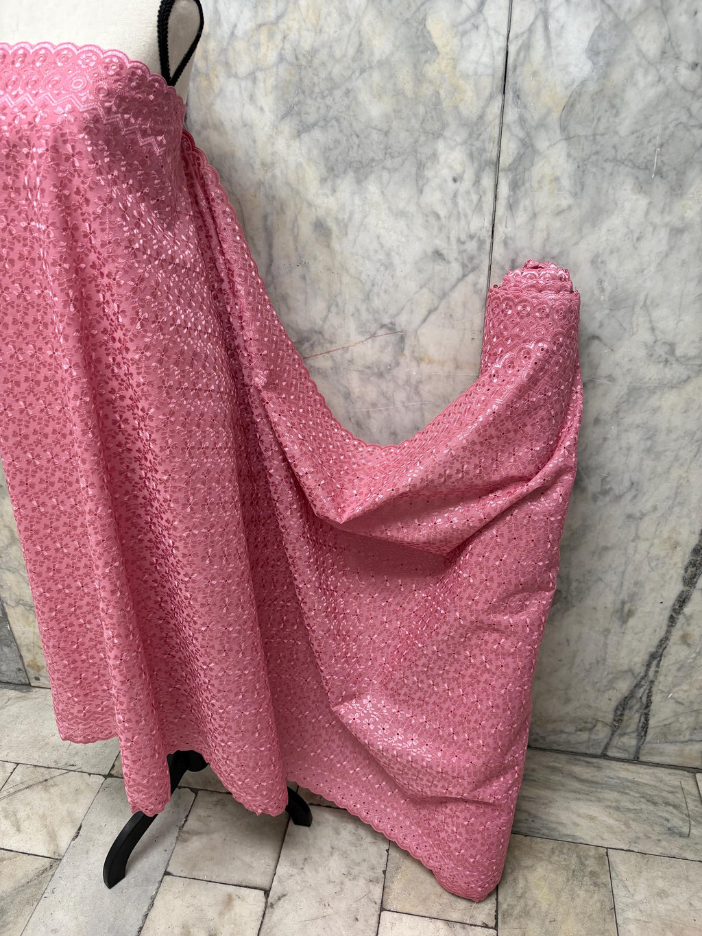 Eyelet fabric made of poly-cotton with all-over embroidery and double scalloped edges for a delicate finish. color Mauve design # 2