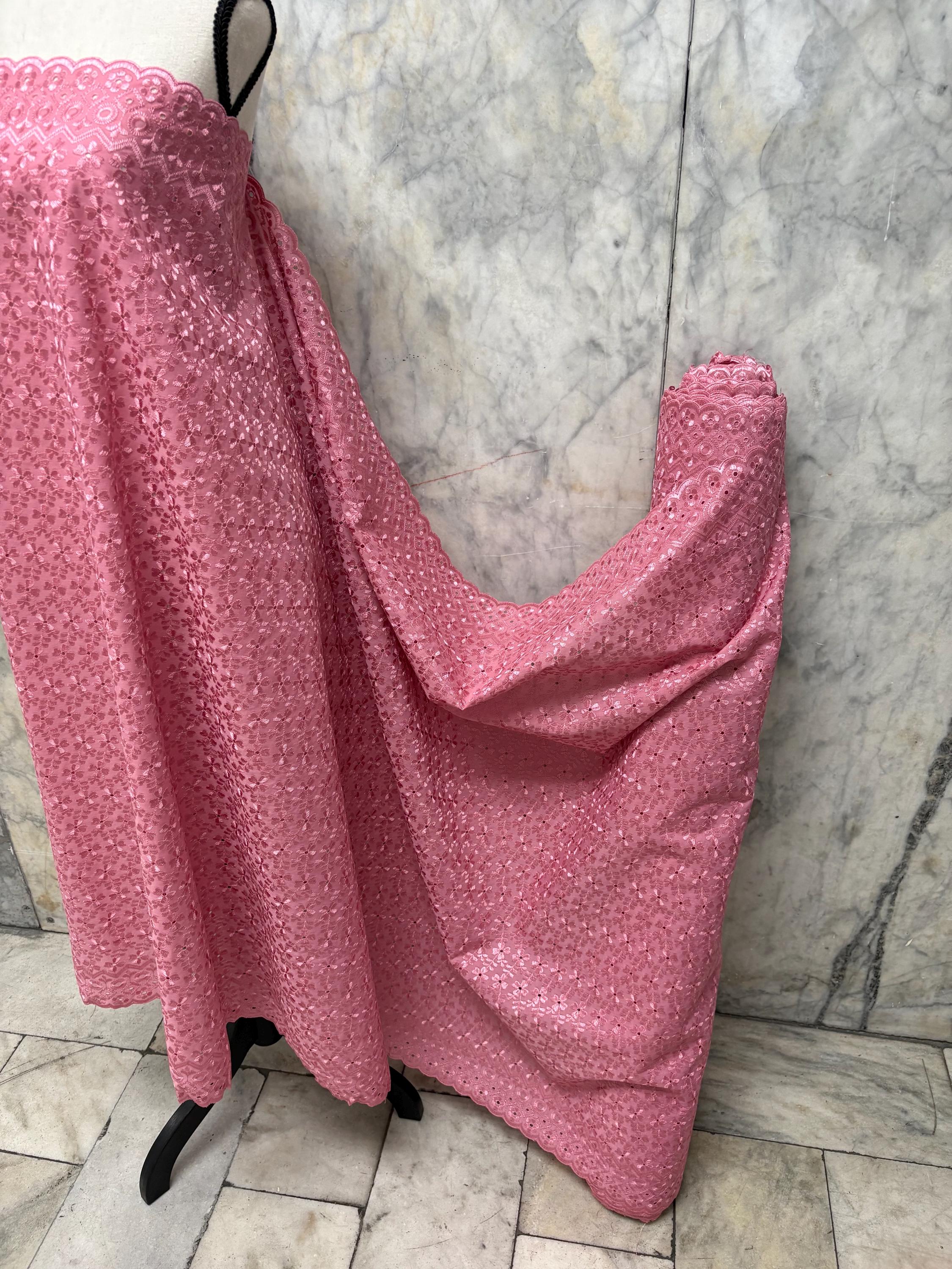 Eyelet fabric made of poly-cotton with all-over embroidery and double scalloped edges for a delicate finish. color Mauve design # 2