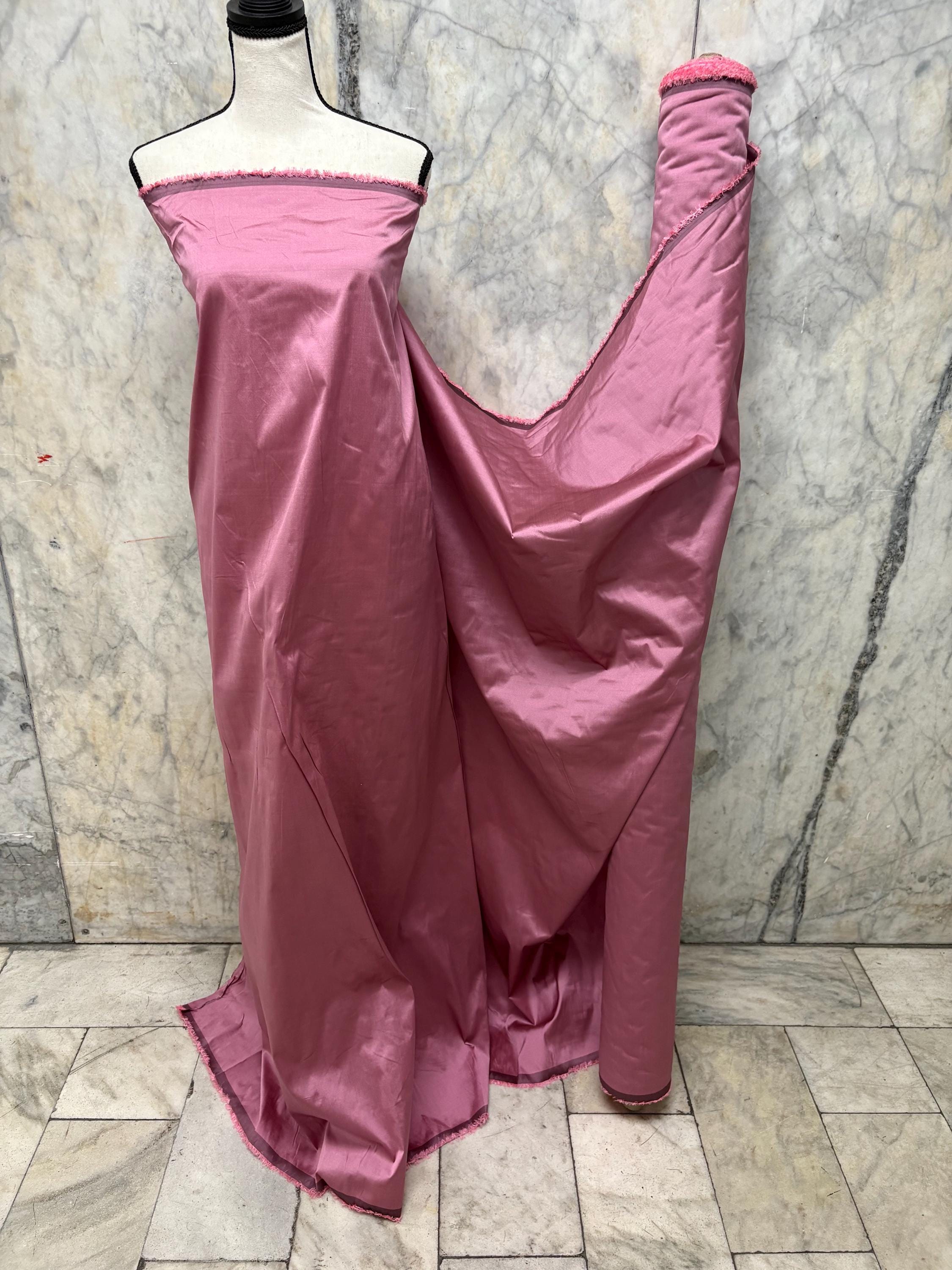 2-yard cut of rust taffeta fabric, 58" wide, polyester. Features a black undertone, perfect for party dresses and formal wear.