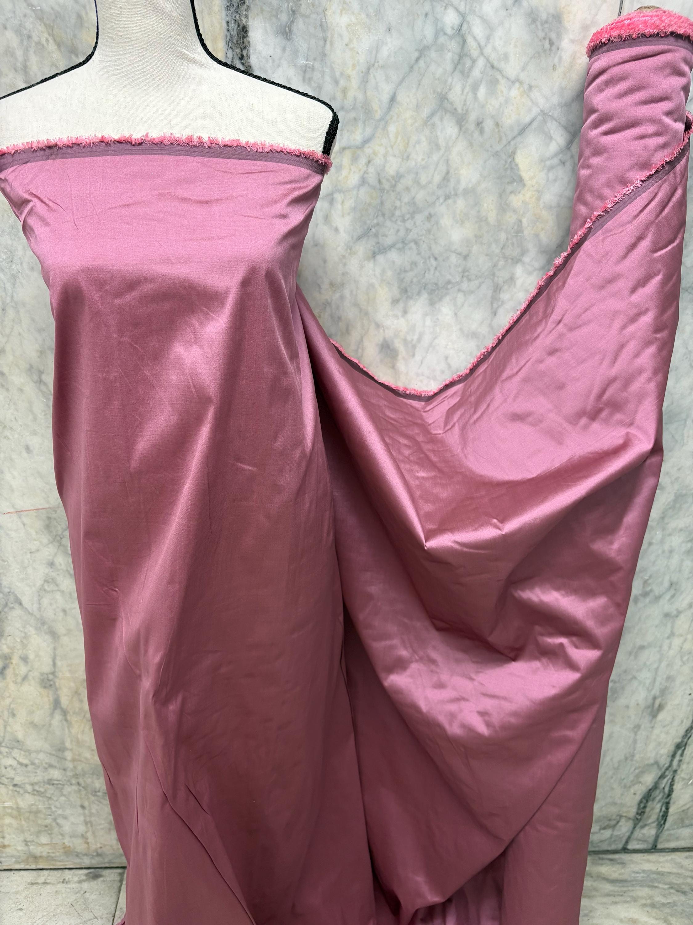 2-yard cut of rust taffeta fabric, 58" wide, polyester. Features a black undertone, perfect for party dresses and formal wear.