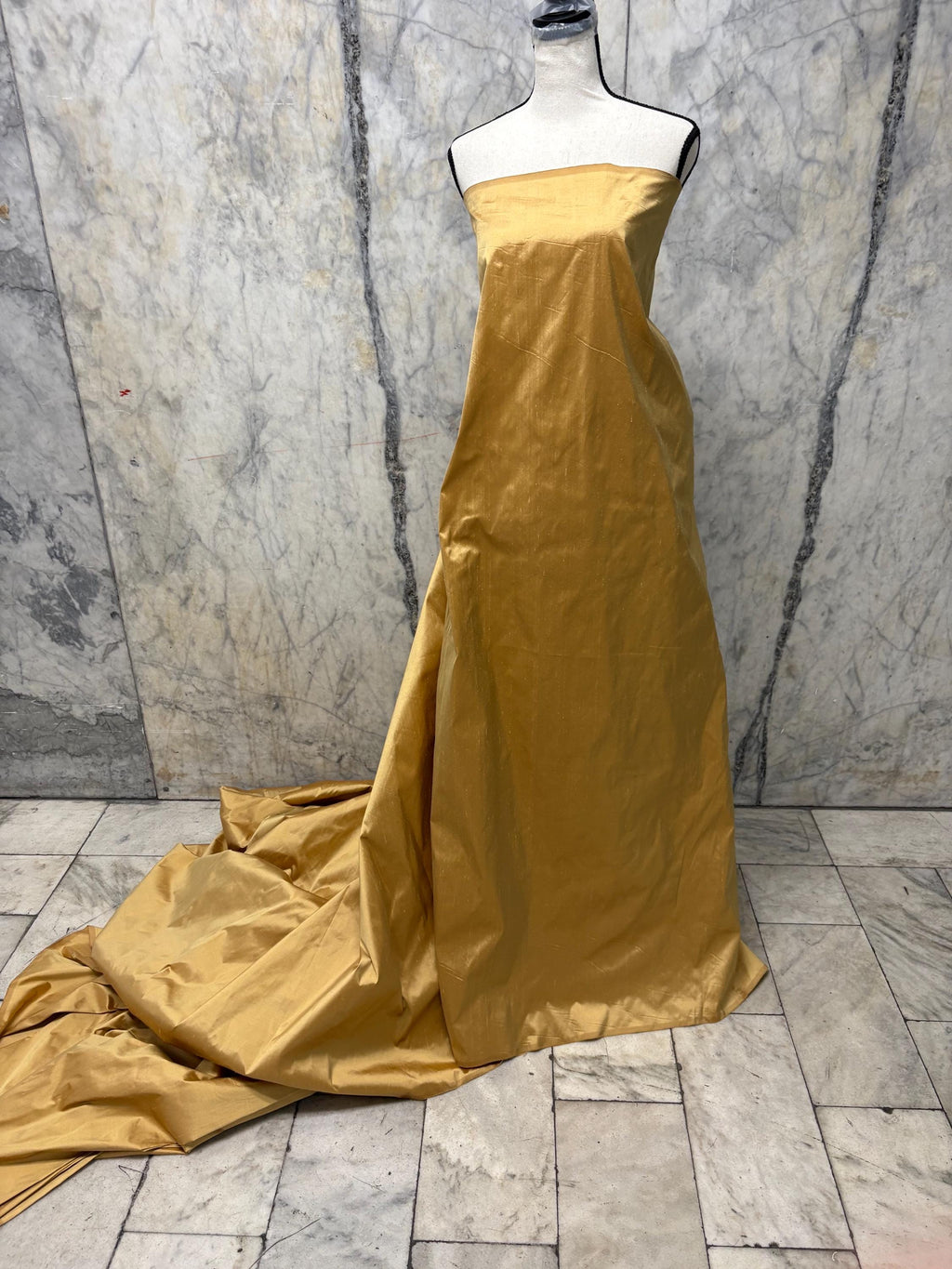 100% silk Taffeta fabric width 54" color is gold. Machine made, fabric has slubs. Free sample. Nas2217 A