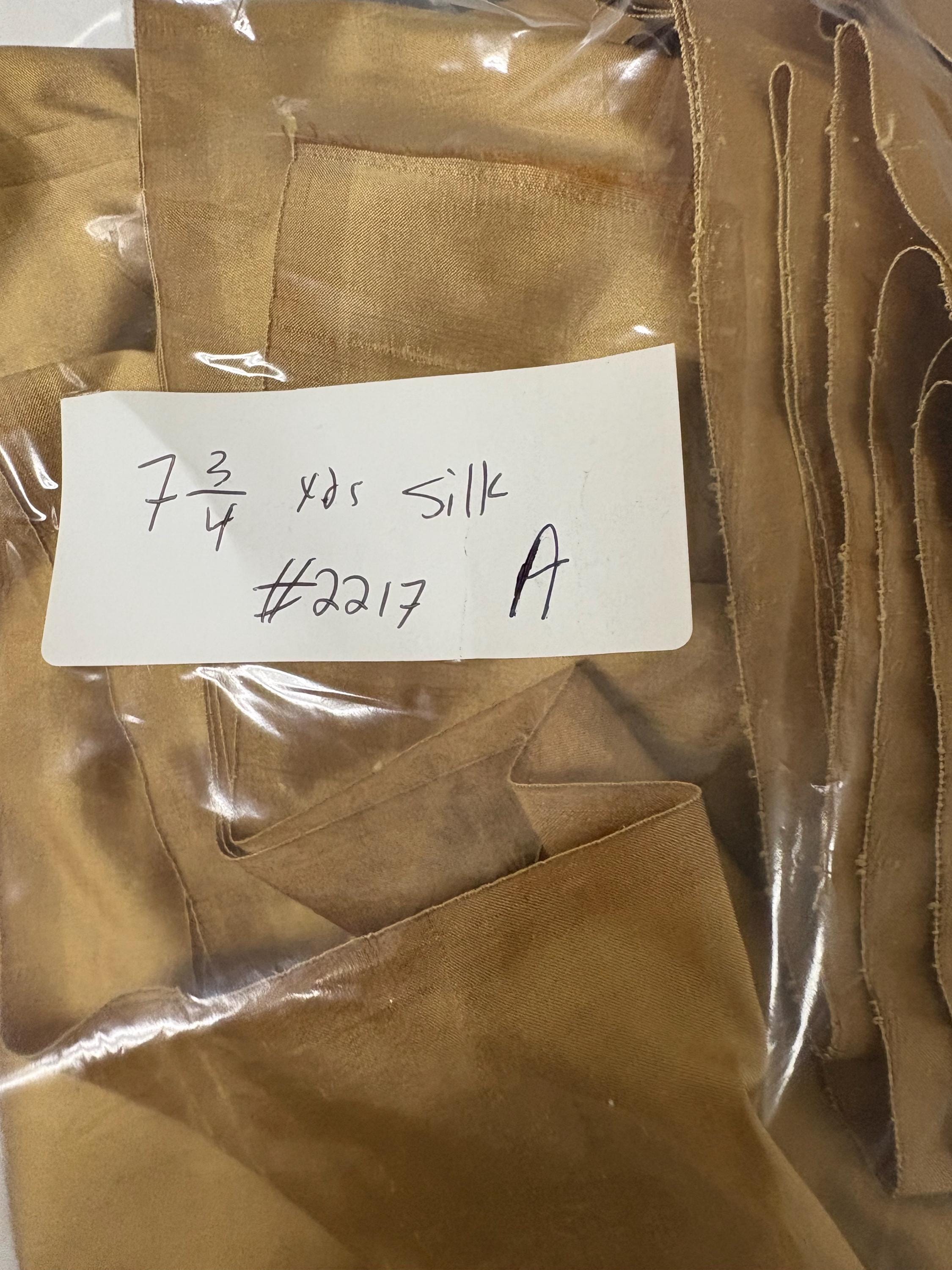 100% silk Taffeta fabric width 54" color is gold. Machine made, fabric has slubs. Free sample. Nas2217 A