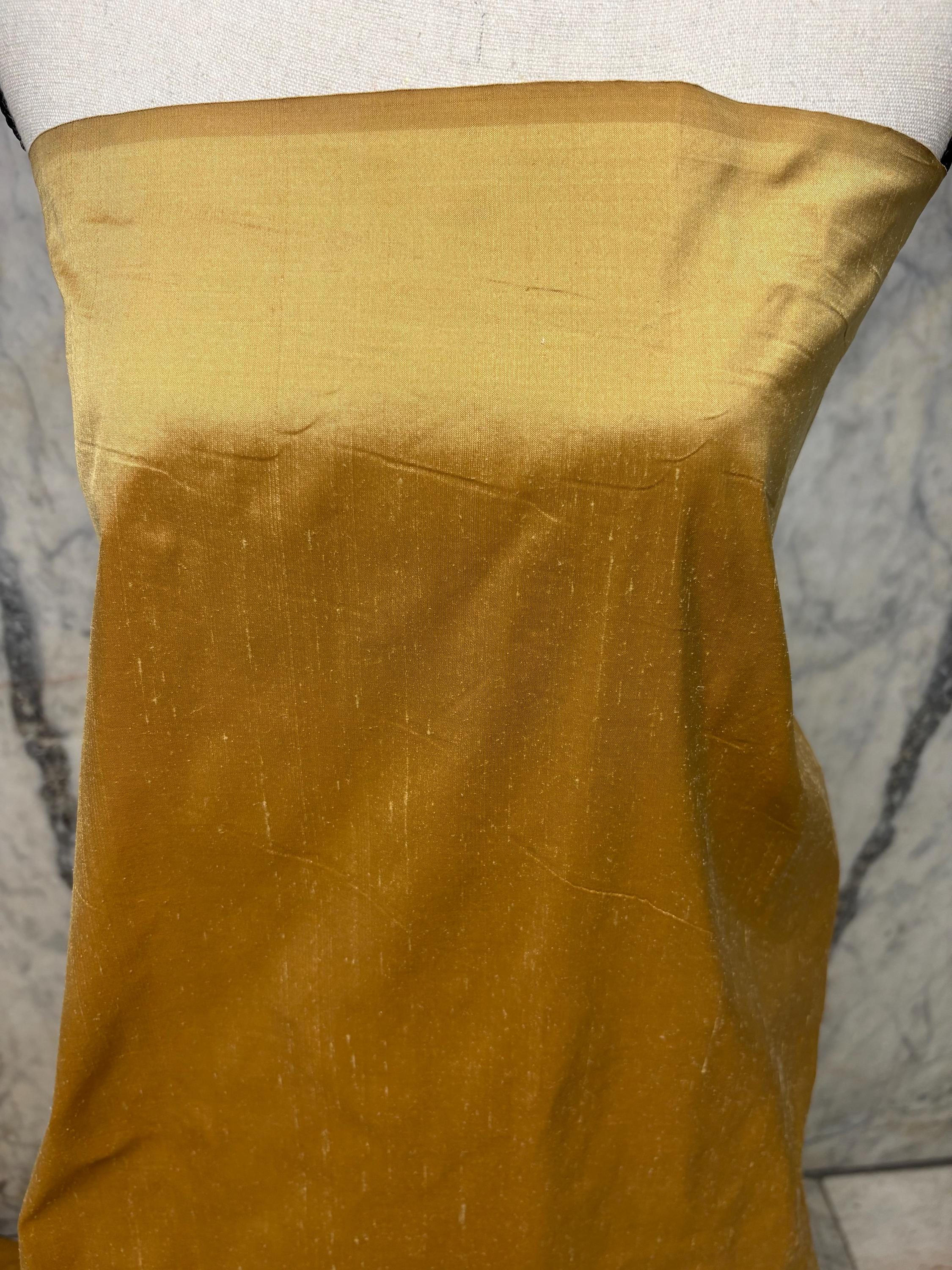 100% silk Taffeta fabric width 54" color is gold. Machine made, fabric has slubs. Free sample. Nas2217 A