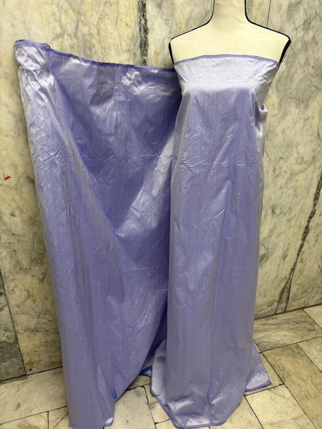 Lilac silk Taffeta width 54" color is Lilac with white warp. Machine made, fabric has thin slubs. Item NAS 2286