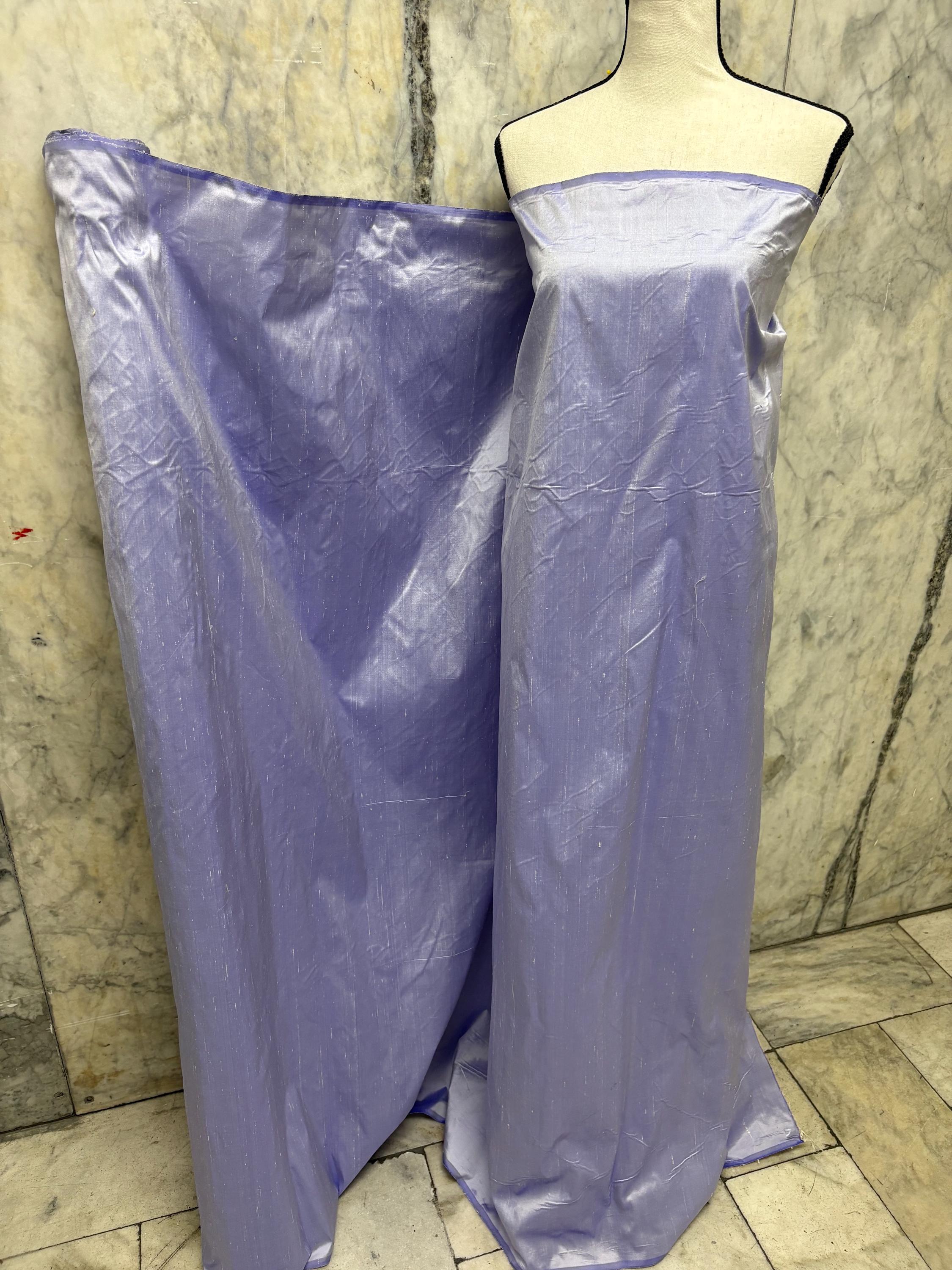 Lilac silk Taffeta width 54" color is Lilac with white warp. Machine made, fabric has thin slubs. Item NAS 2286