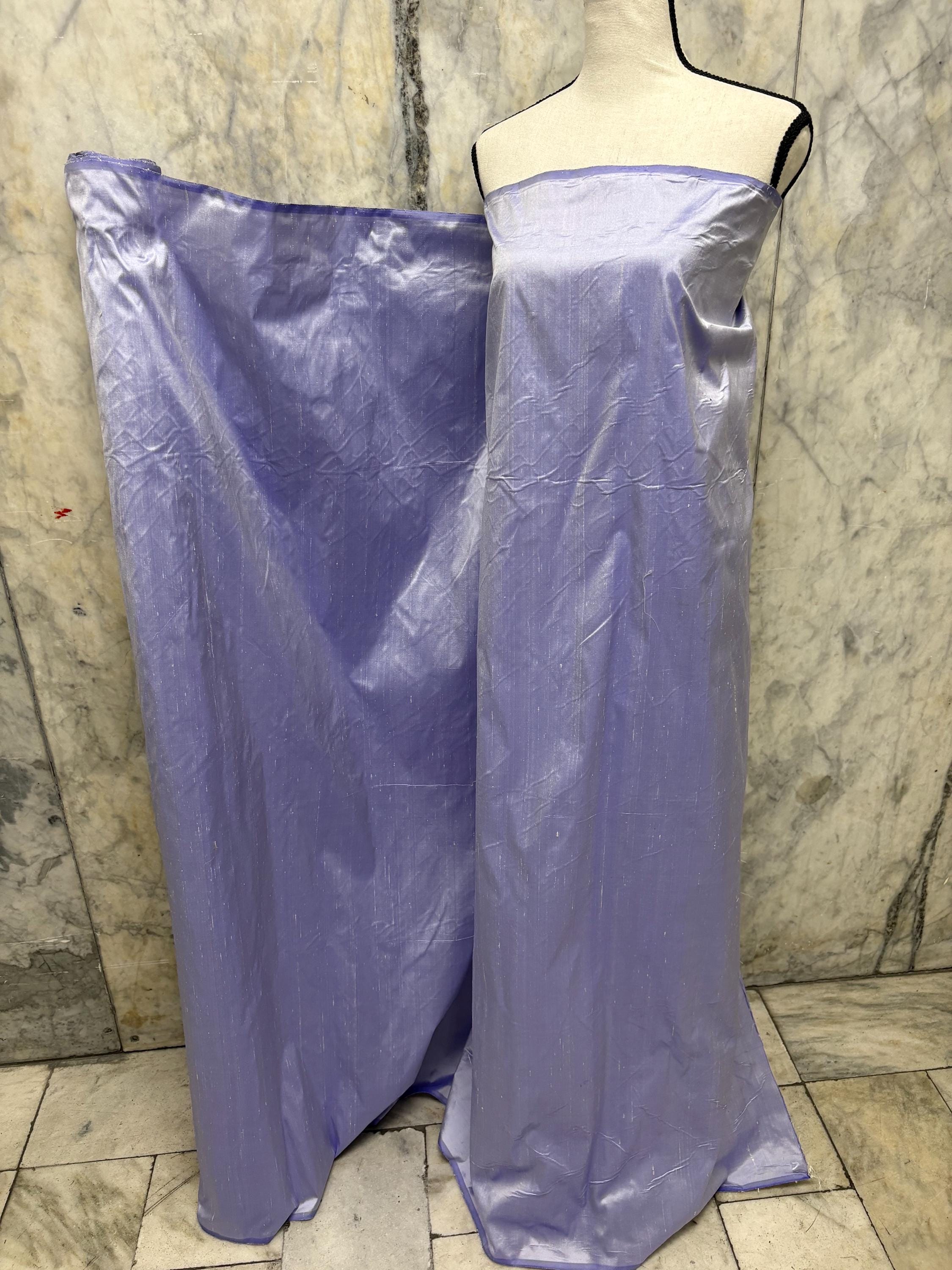 Lilac silk Taffeta width 54" color is Lilac with white warp. Machine made, fabric has thin slubs. Item NAS 2286