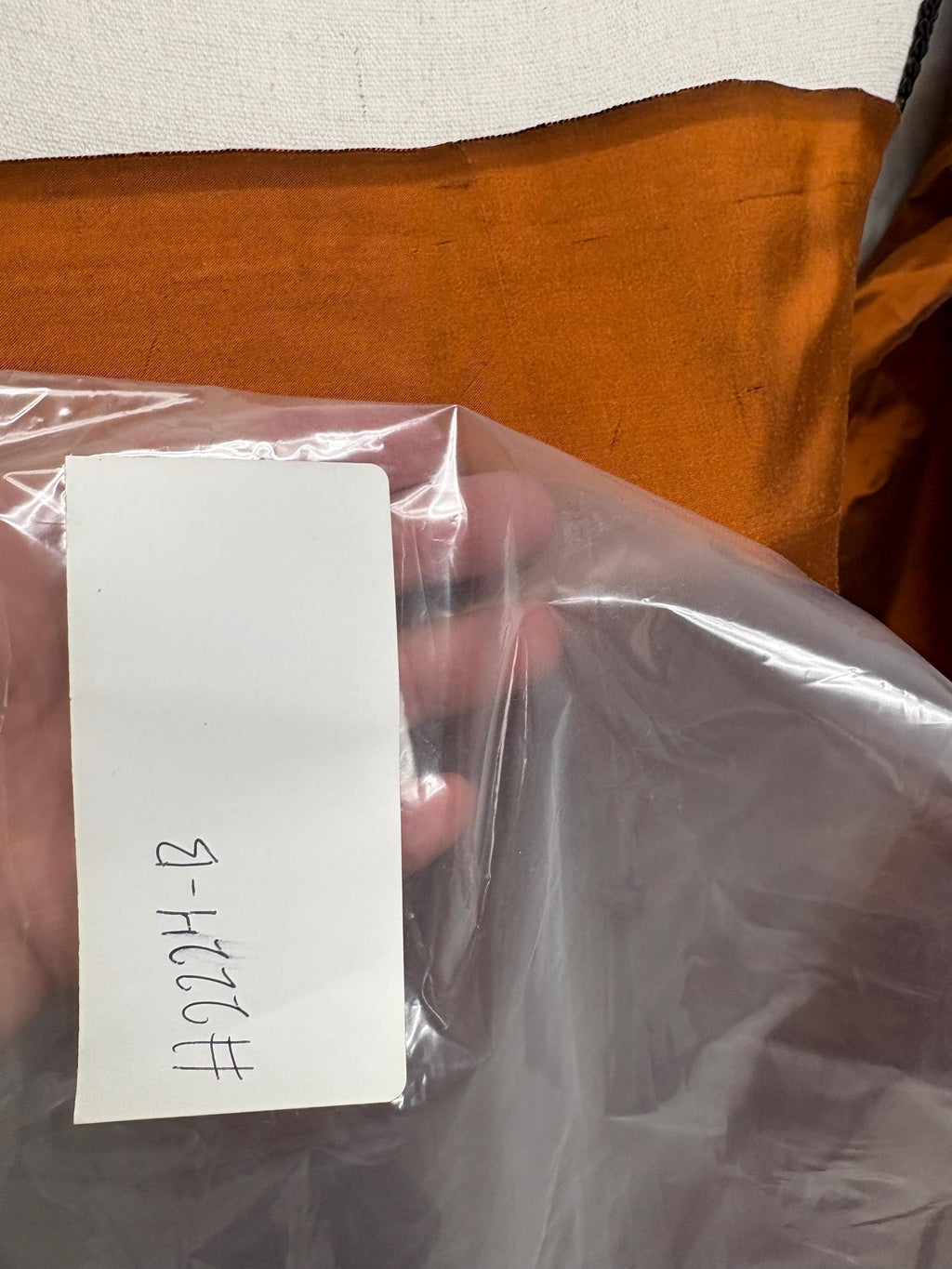 100% silk Dupioni Taffeta width 54" color is Rust with black warp. Machine made, fabric has slubs. Item # 8. free sample. Nas2224-B