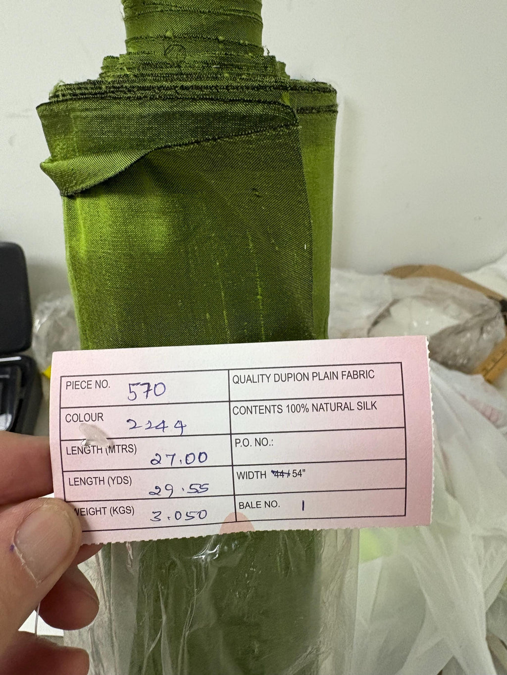 100% silk Dupioni Taffeta width 54" color is Lime with black warp. Machine made, fabric has slubs. free sample. Nas2244