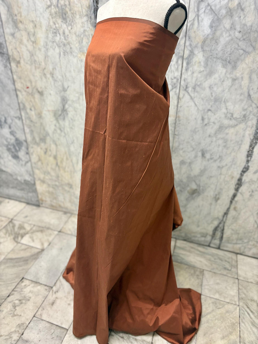 100% silk Dupioni Taffeta width 54" color is Rust with black warp. Machine made, fabric has slubs. free sample. Nas2224-B (dark shade)