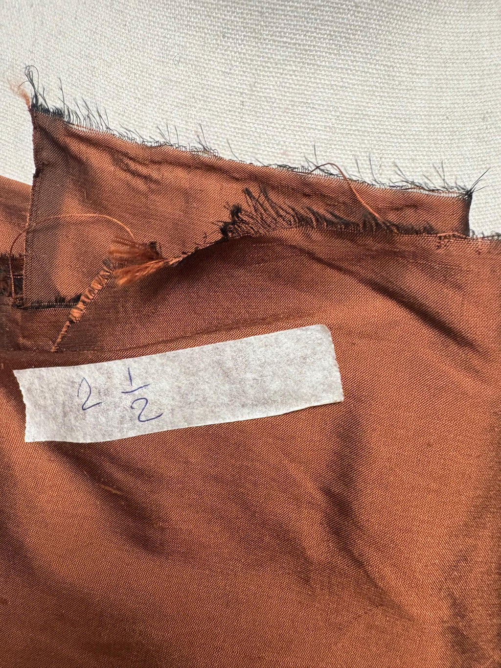 100% silk Dupioni Taffeta width 54" color is Rust with black warp. Machine made, fabric has slubs. free sample. Nas2224-B (dark shade)