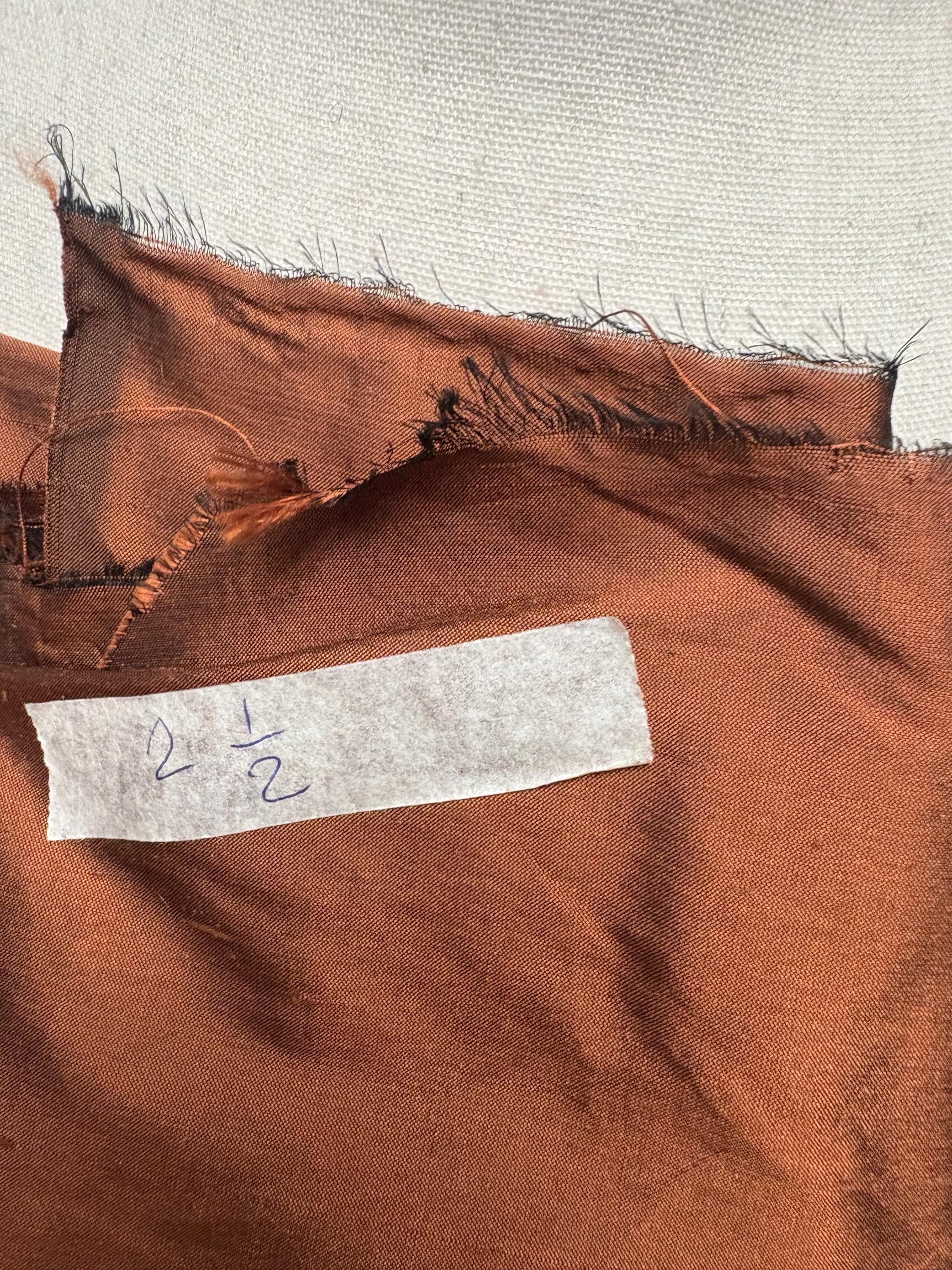 100% silk Dupioni Taffeta width 54" color is Rust with black warp. Machine made, fabric has slubs. free sample. Nas2224-B (dark shade)