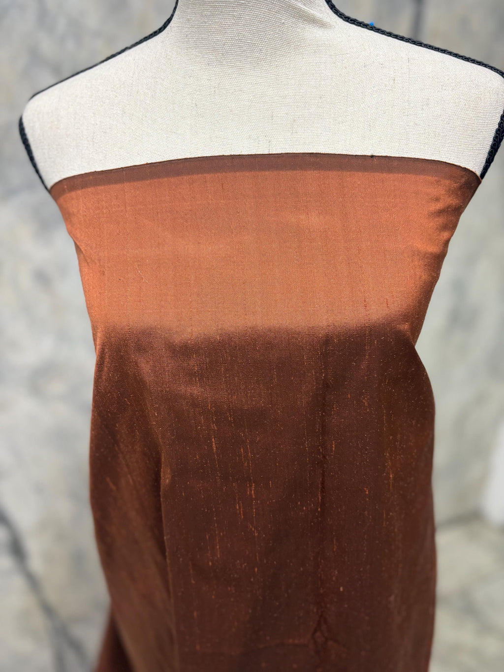 100% silk Dupioni Taffeta width 54" color is Rust with black warp. Machine made, fabric has slubs. free sample. Nas2224-B (dark shade)