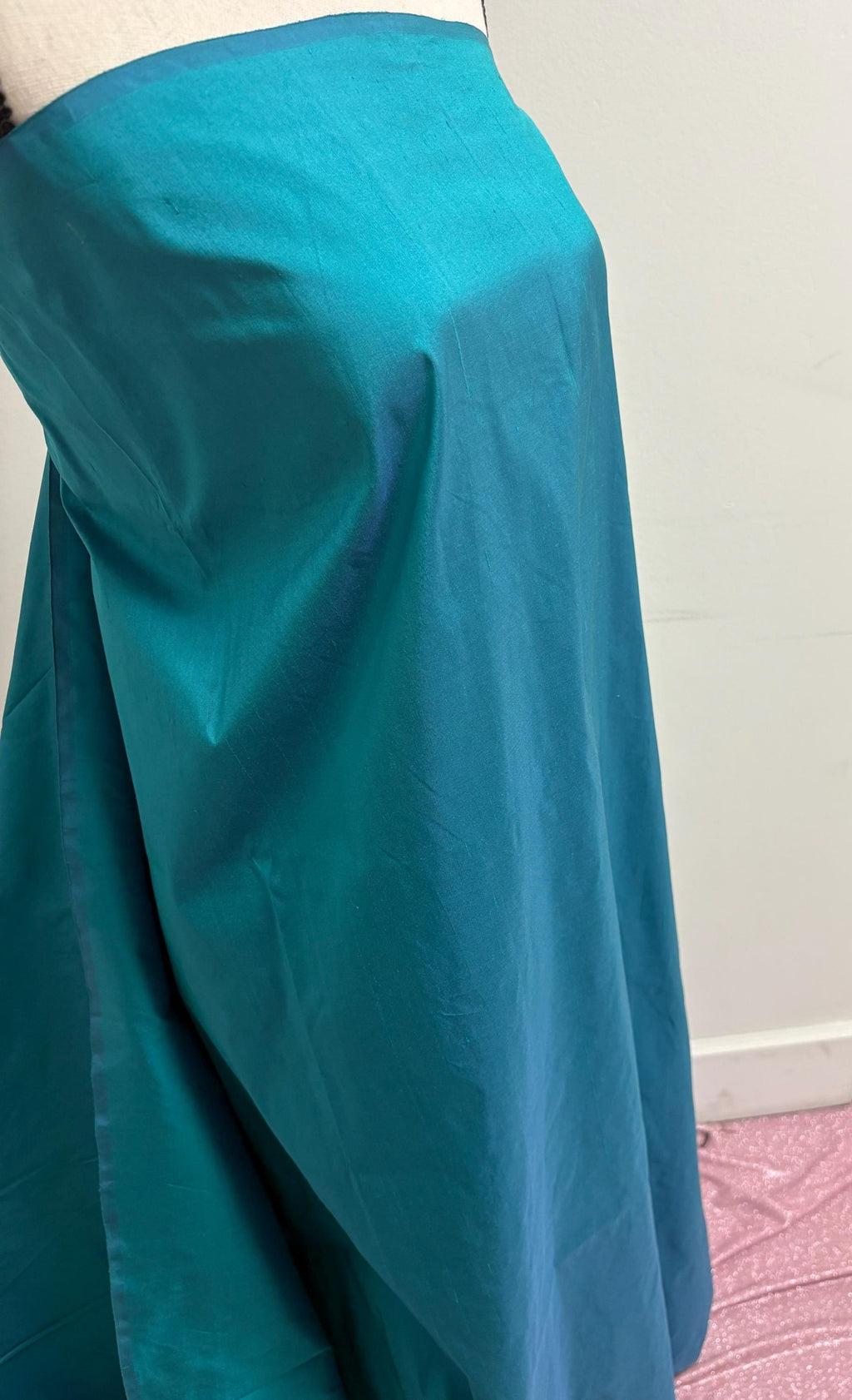 100% silk Dupioni Taffeta width 54" color is Turquoise. Machine made, fabric has slubs. Item # 10. free sample.