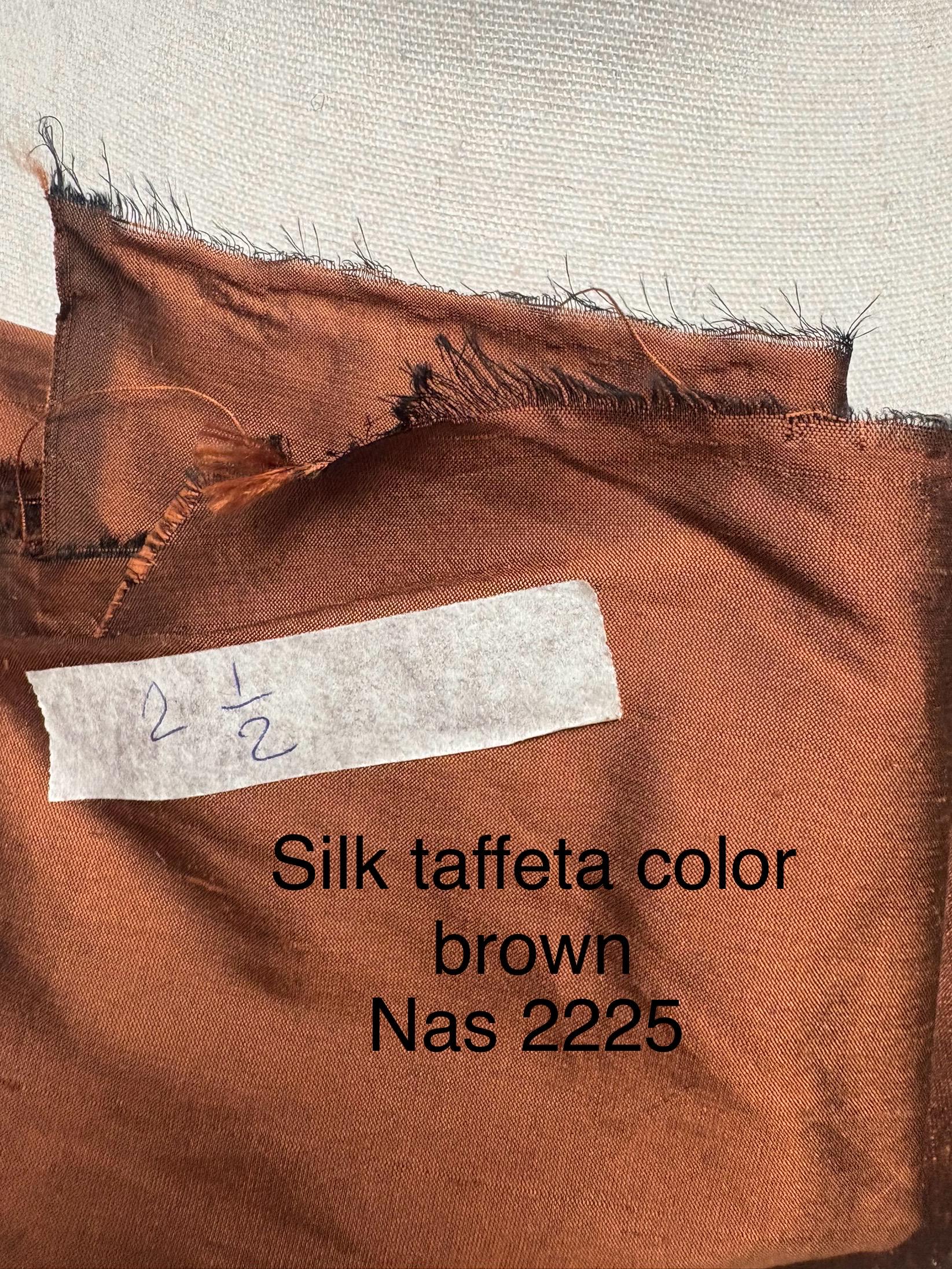100% silk Dupioni Taffeta width 54" color is Rust with black warp. Machine made, fabric has slubs. free sample. Nas2224-B (dark shade)