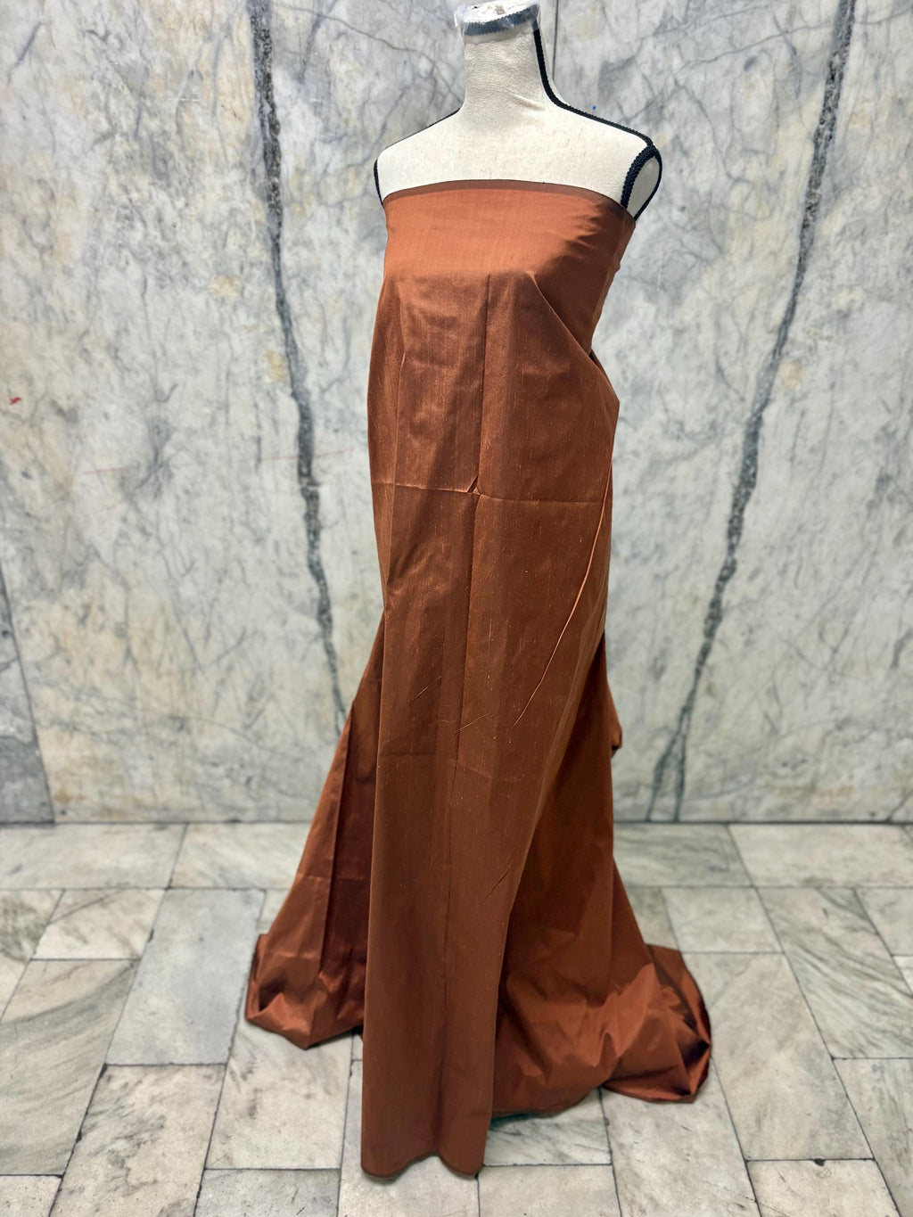 100% silk Dupioni Taffeta width 54" color is Rust with black warp. Machine made, fabric has slubs. free sample. Nas2224-B (dark shade)