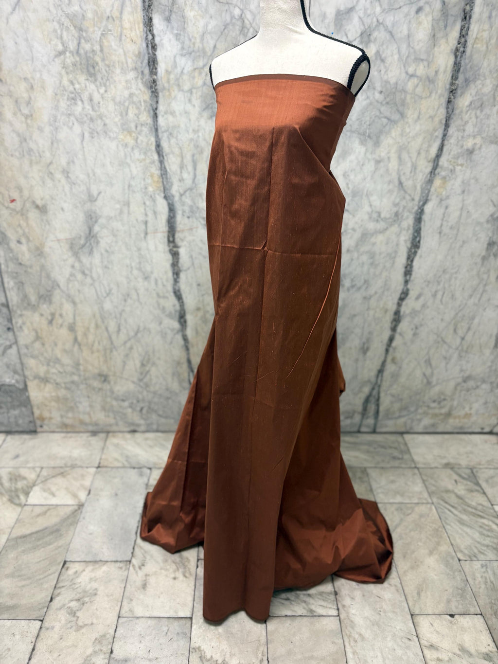 100% silk Dupioni Taffeta width 54" color is Rust with black warp. Machine made, fabric has slubs. free sample. Nas2224-B (dark shade)