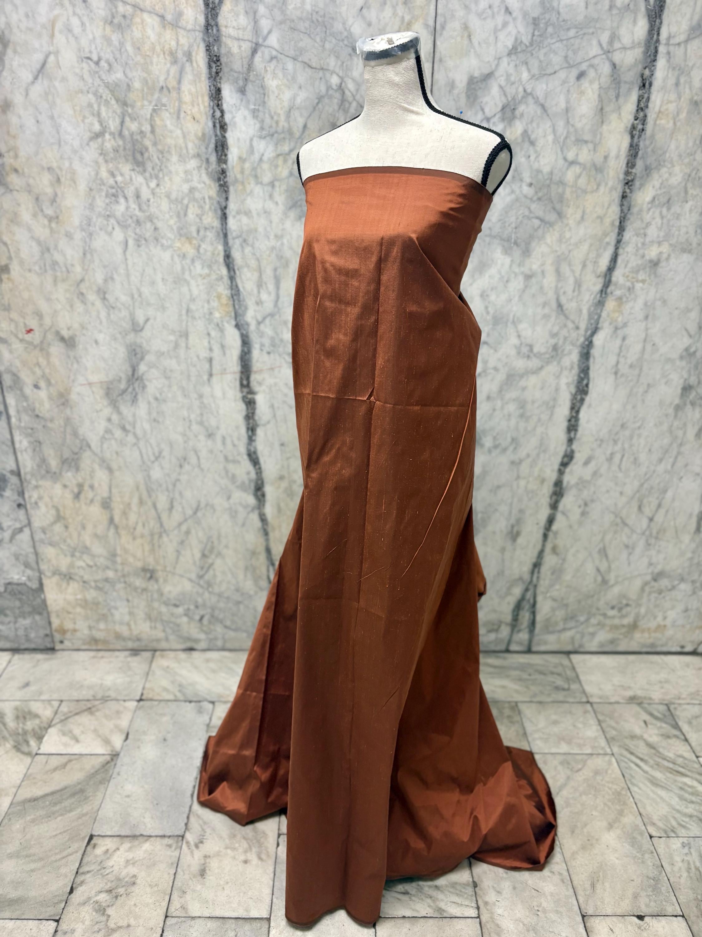 100% silk Dupioni Taffeta width 54" color is Rust with black warp. Machine made, fabric has slubs. free sample. Nas2224-B (dark shade)