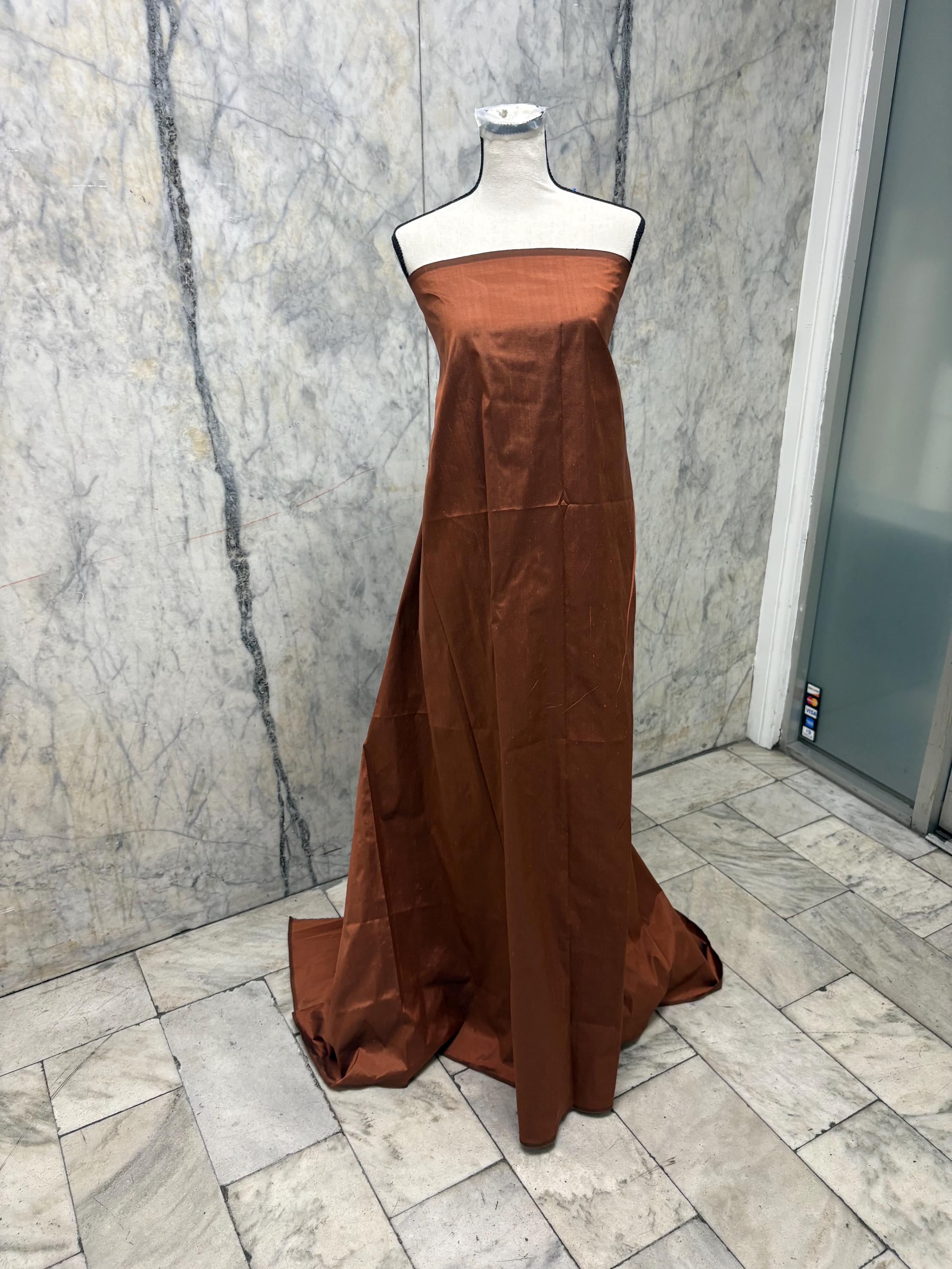 100% silk Dupioni Taffeta width 54" color is Rust with black warp. Machine made, fabric has slubs. free sample. Nas2224-B (dark shade)
