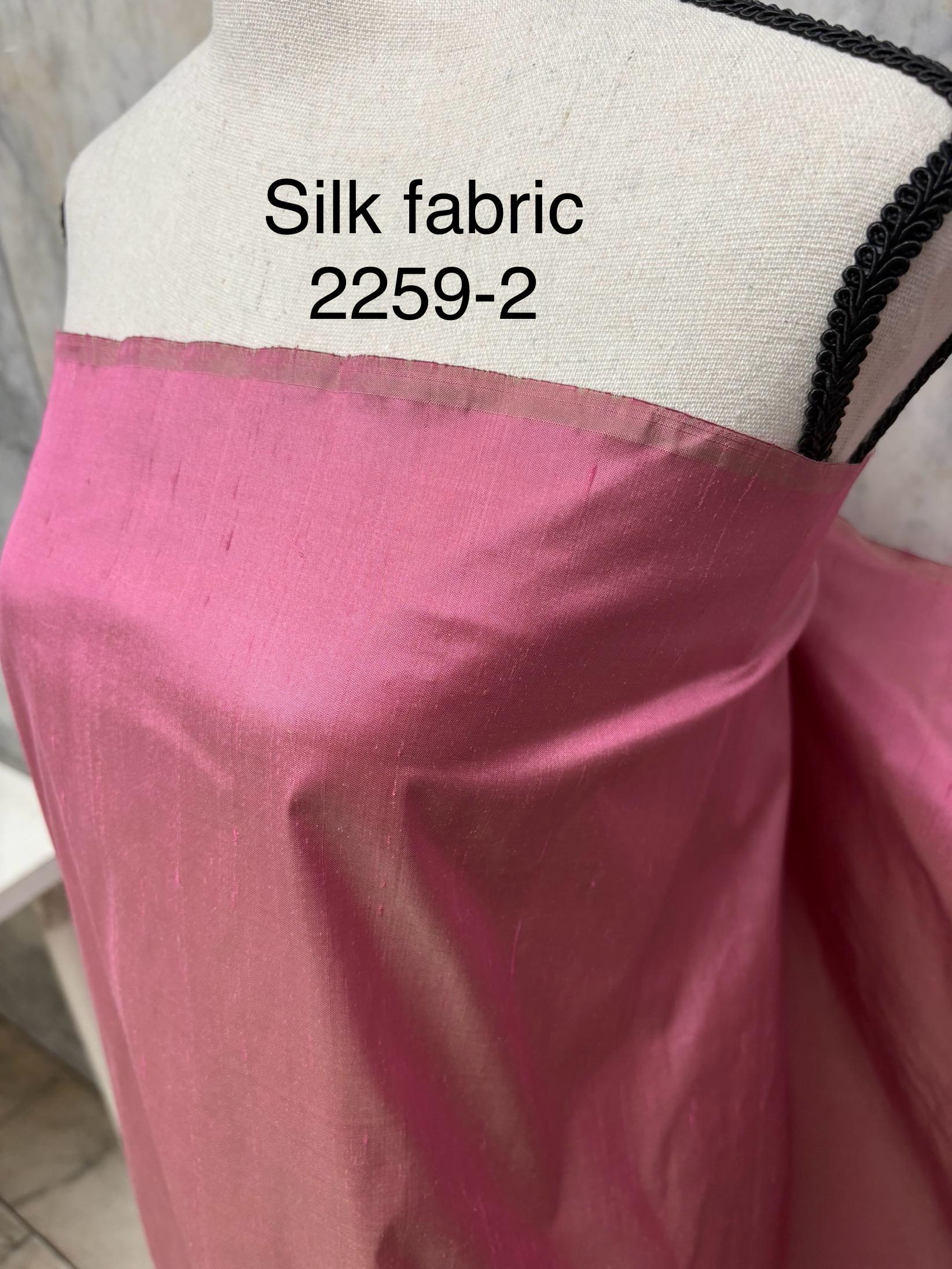 100% silk Dupioni Taffeta width 54" color Dusty Rose with green sheen. Fabric has slubbed. Check description. Item # 2259-2. NAS.