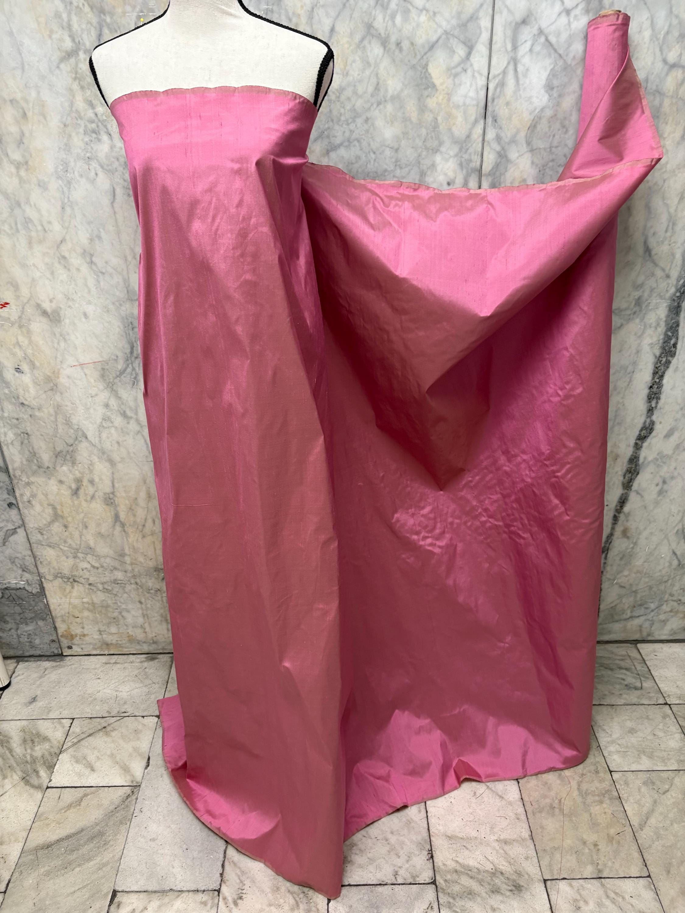 100% silk Dupioni Taffeta width 54" color Dusty Rose with green sheen. Fabric has slubbed. Check description. Item # 2259-2. NAS.