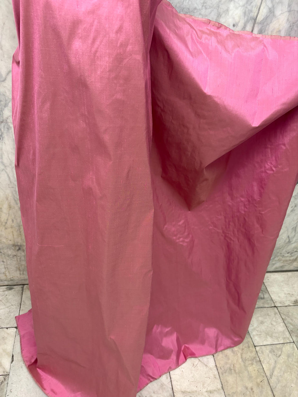 100% silk Dupioni Taffeta width 54" color Dusty Rose with green sheen. Fabric has slubbed. Check description. Item # 2259-2. NAS.