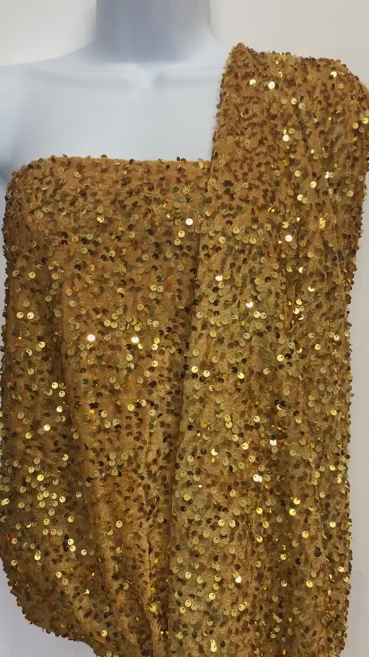 Pane velour sequins fabric, color gold width 59/60" 100% polyester. Sells in 1-yard increments, continuous.