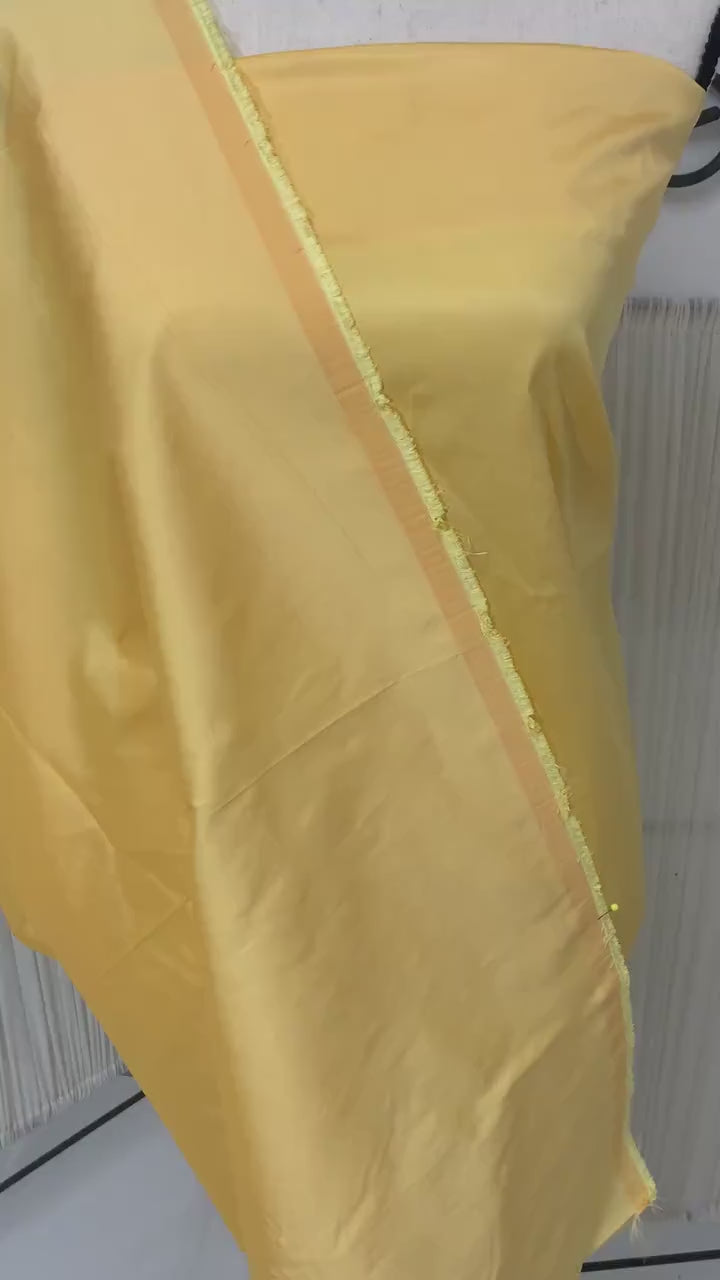 Yellow Taffeta Two tone fabric width 58" polyester actual color is yellow with gold tone great for party dress.