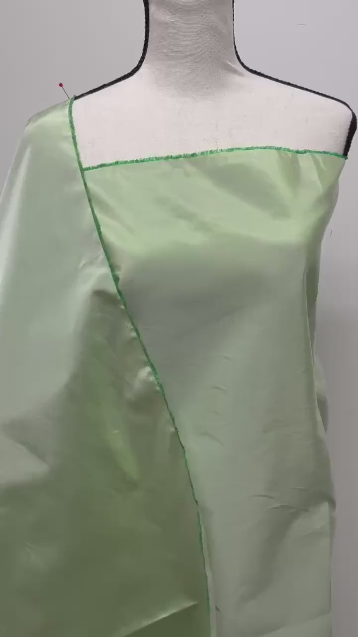 Lt. sage Taffeta fabric . Two tone fabric width 58" polyester fabric made two color green and white. item # 115