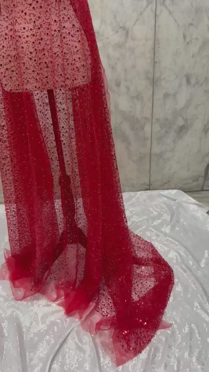 Red Beaded sequence mesh, width of sequence area is 50", plain mesh salvages on both end. item D8-NAS