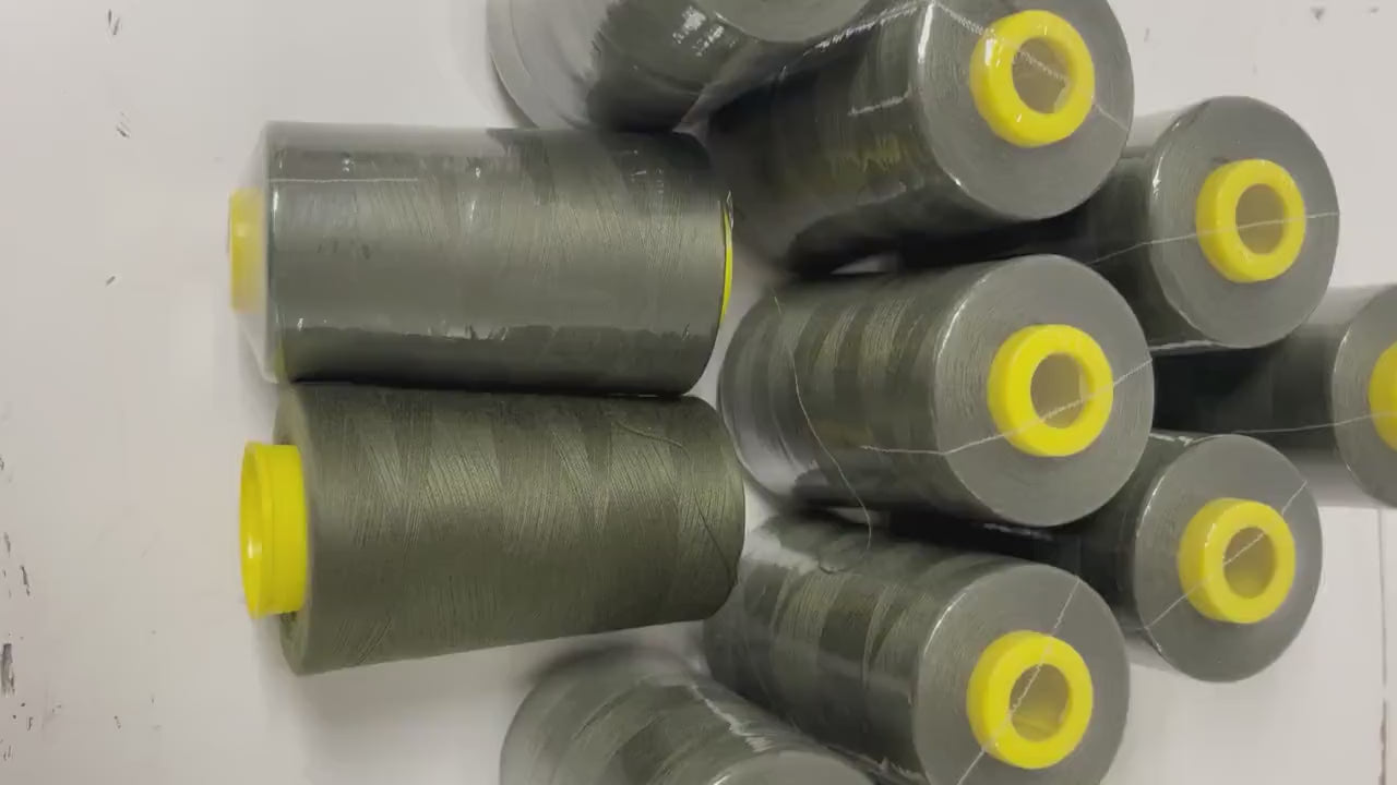 Olive sewing threads, polyester 130 gram per cone, 5000 yards per cone, wrap in clear cover for daily sewing. size 24T. made in usa. PT 945