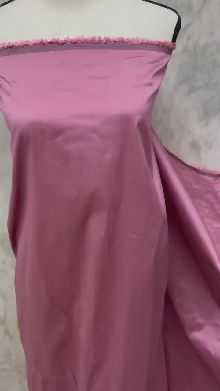 2-yard cut of rust taffeta fabric, 58" wide, polyester. Features a black undertone, perfect for party dresses and formal wear.