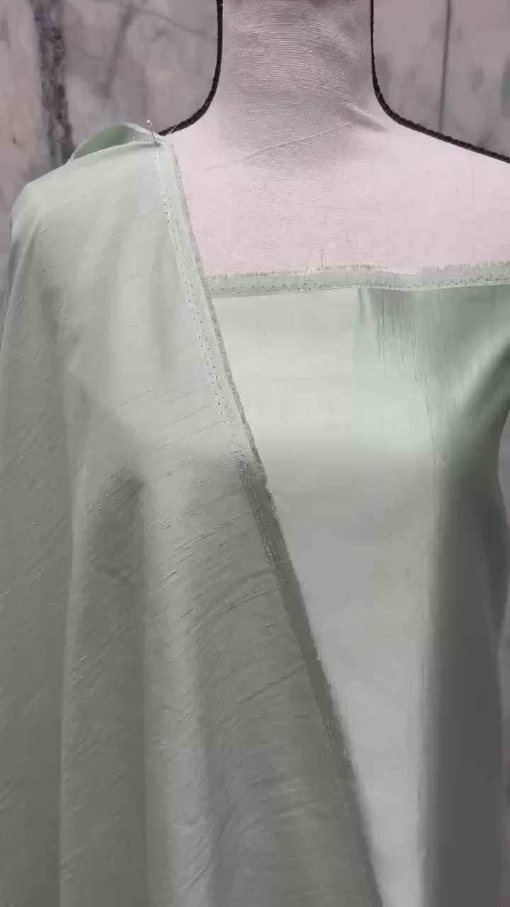 A 2 3/4 yards cut fabric satin shantung color Lt. sage, double sided fabric width 58 inch. polyester