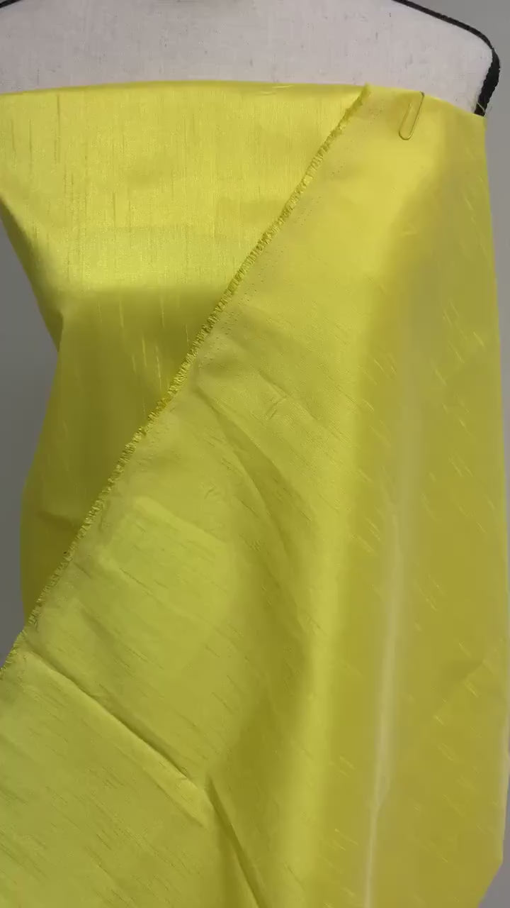 A 2 yards cut Dupioni shantung fabric. Polyester, width 54 inches. color yellow sell by 2 yards cut continuous.