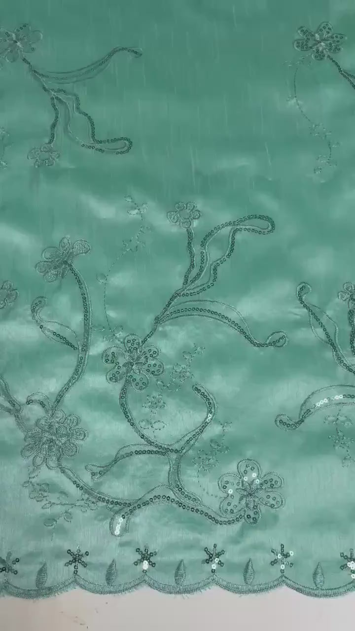 A 3 yards Tiffany satin Shantung Fabric width 58 inches polyester. Double scalloped sequins embroidery with slubbed texture.